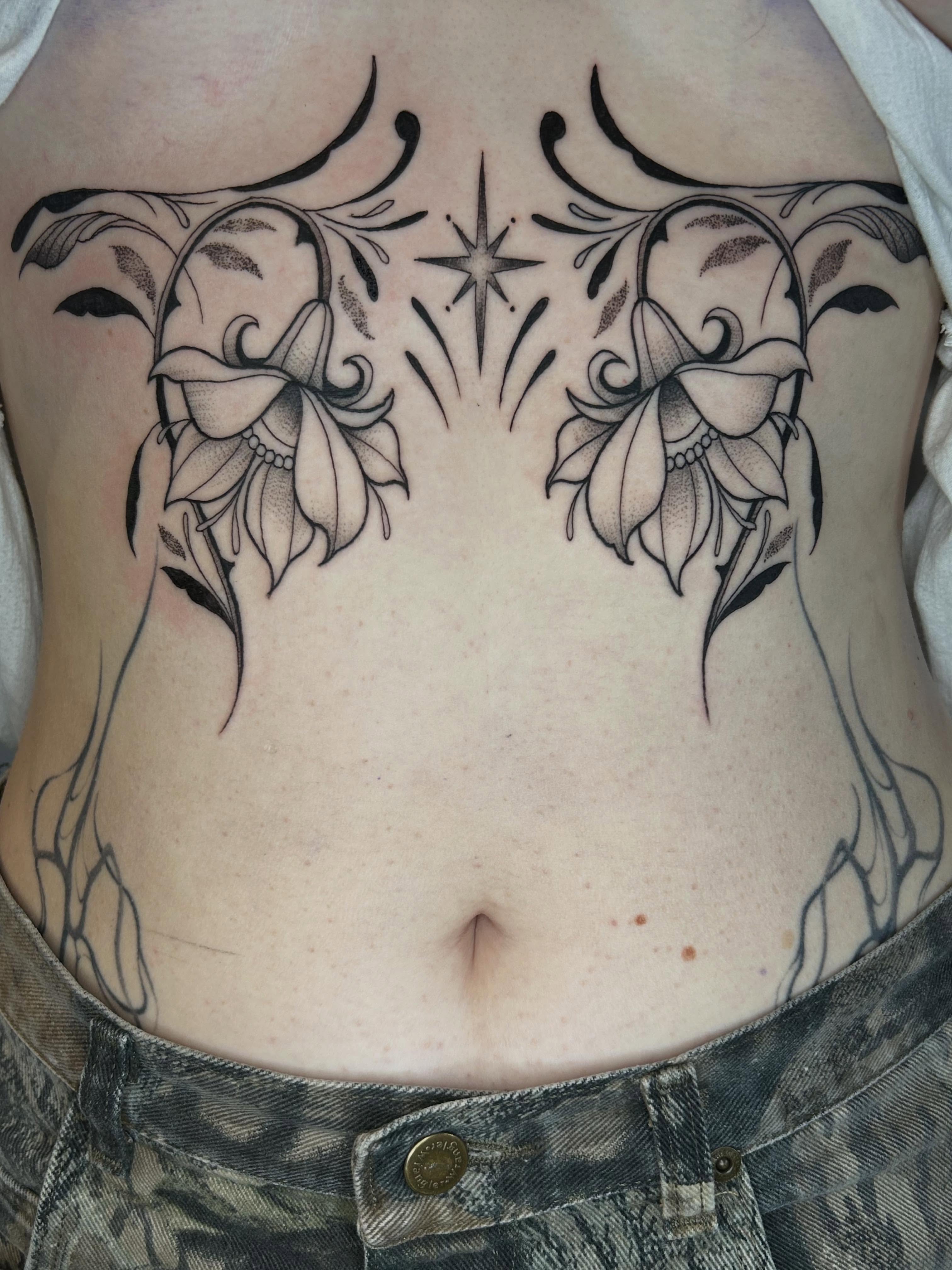 Lilies and stars black and grey tattoo on the ribs by Cassidy Hammer, Westland, Michigan