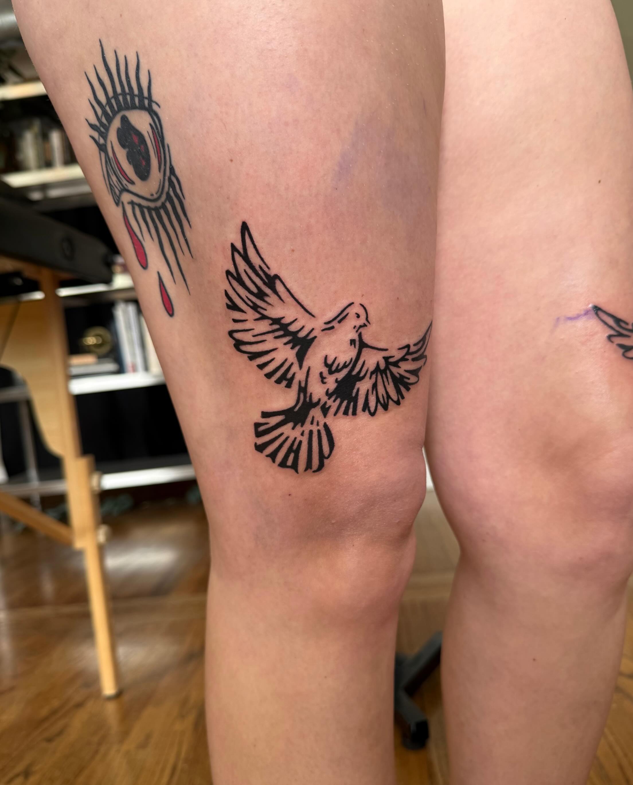 Dove black and grey tattoo on the thigh by M