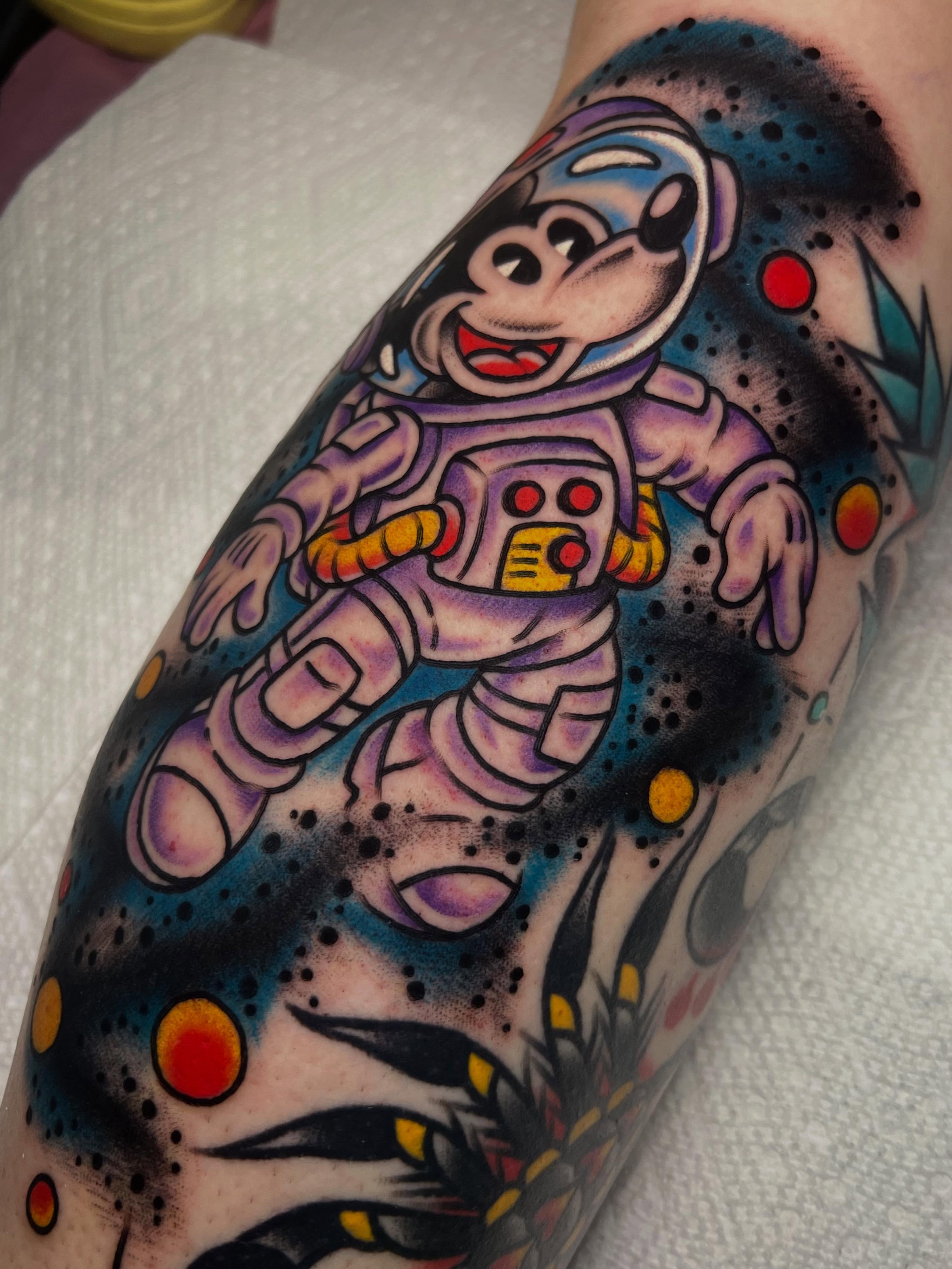 Mickey mouse astronaut American traditional tattoo on the forearm by ᴍᴀᴛᴛ ᴀʟᴇxᴀɴᴅᴇʀ
