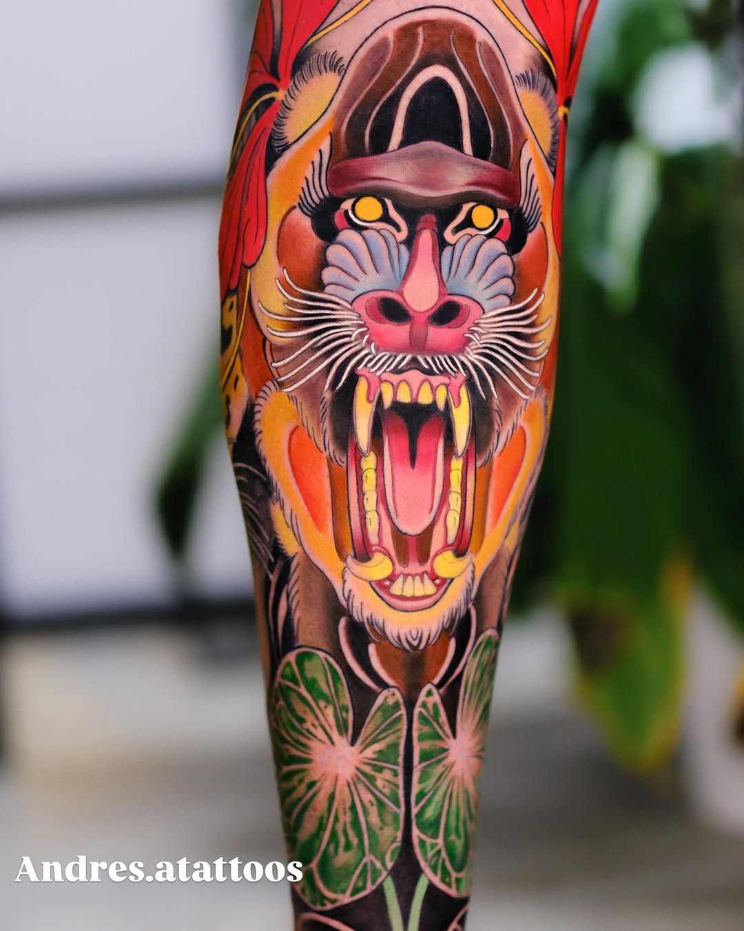 Baboon face with leaves realism tattoo on the forearm by Andres Acevedo, Denver, Colorado