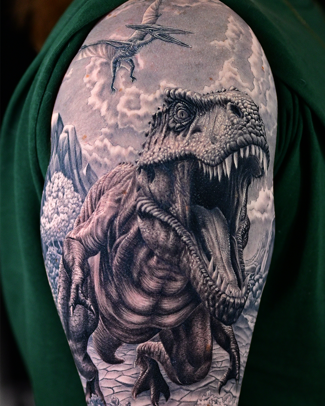 Tyrannosaurus rex realism tattoo on the upper arm by Sean OHara
