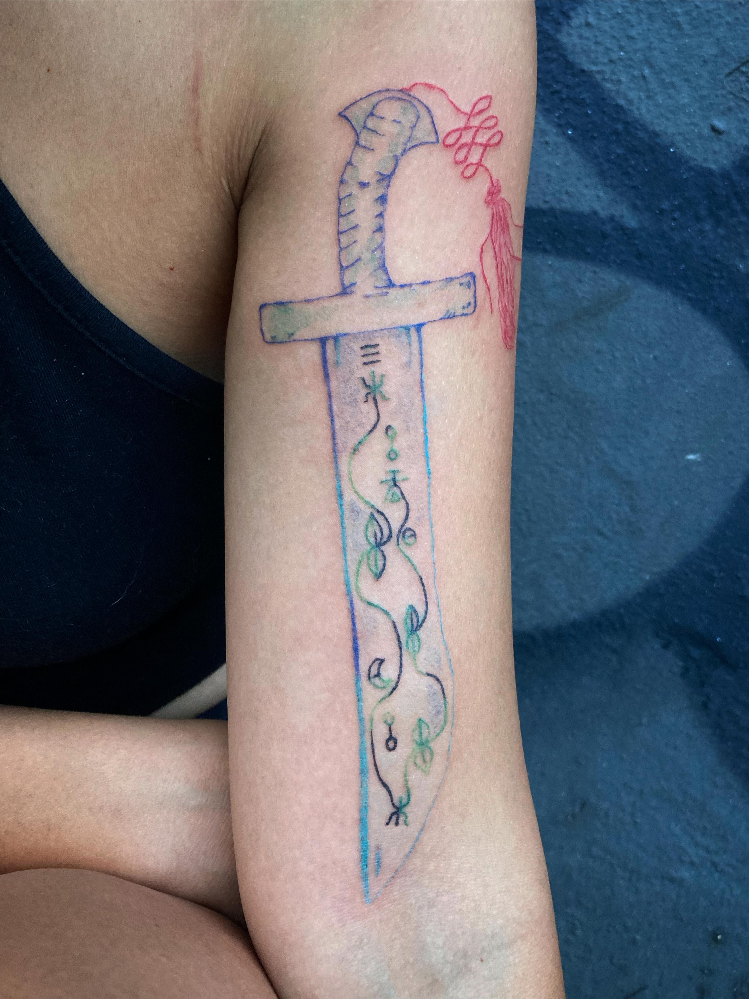 Sword watercolor tattoo on the forearm by 잡초