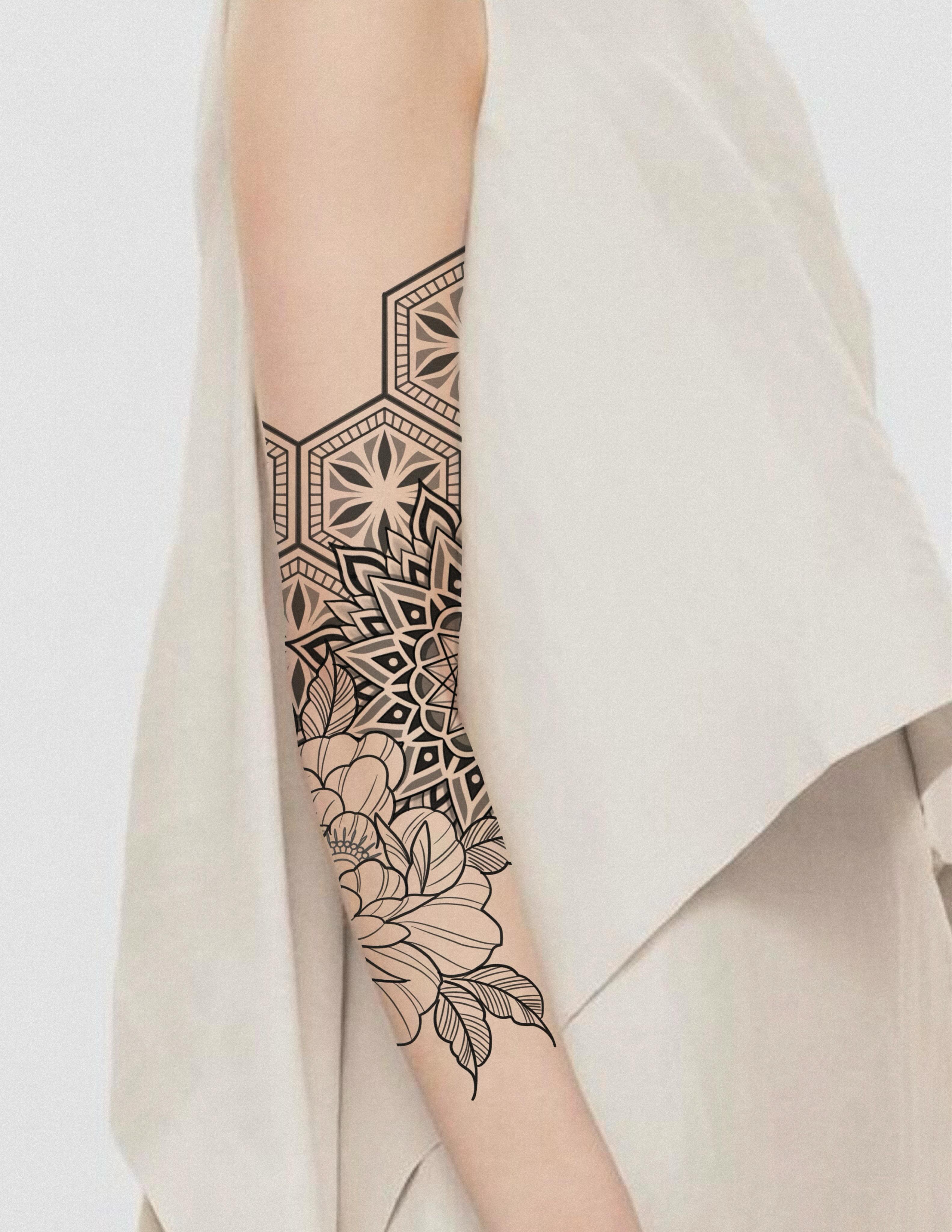 Geometric floral geometric tattoo on the forearm by Ravi Chandra, Mount Shasta, California