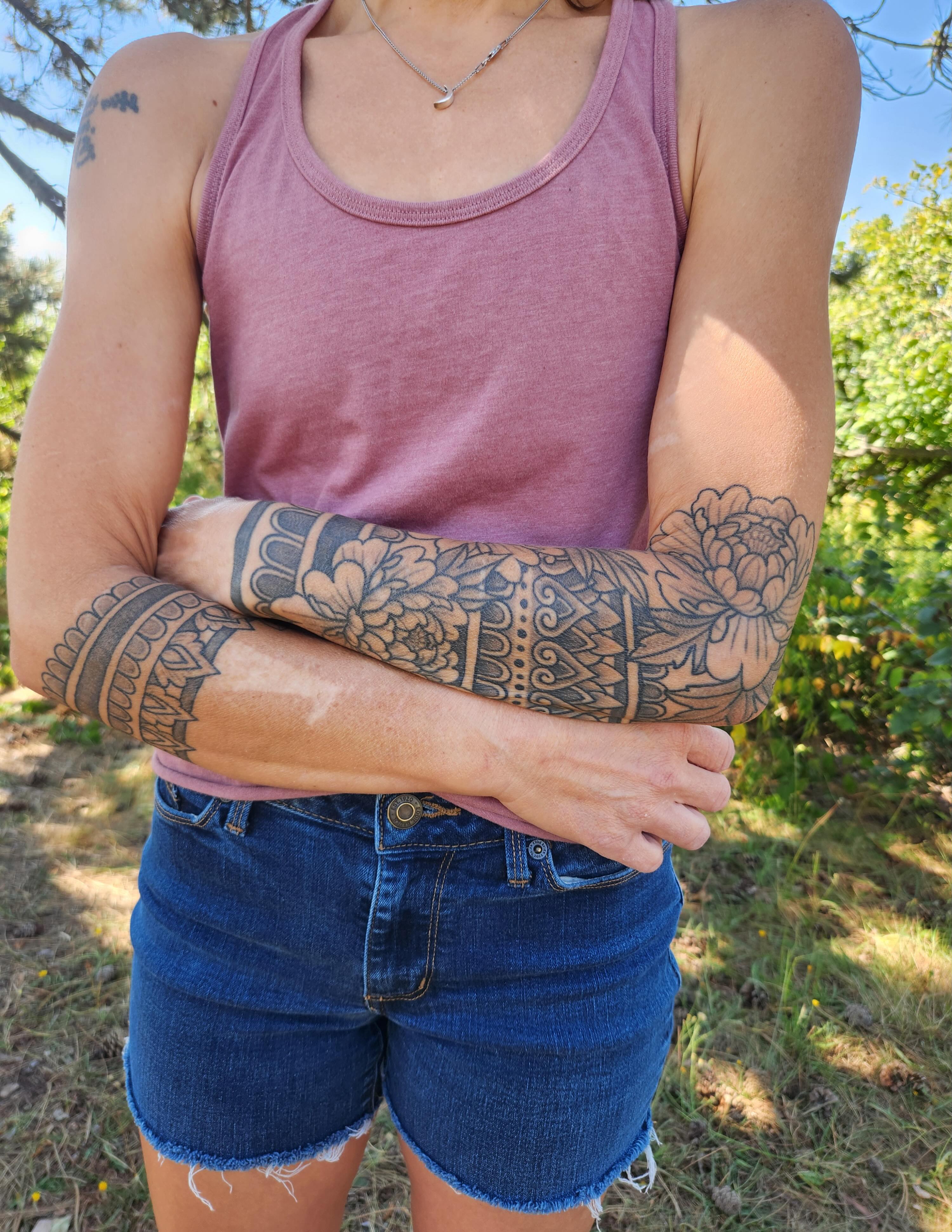 Floral sleeve black and grey tattoo on the upper arm by Ravi Chandra, Mount Shasta, California