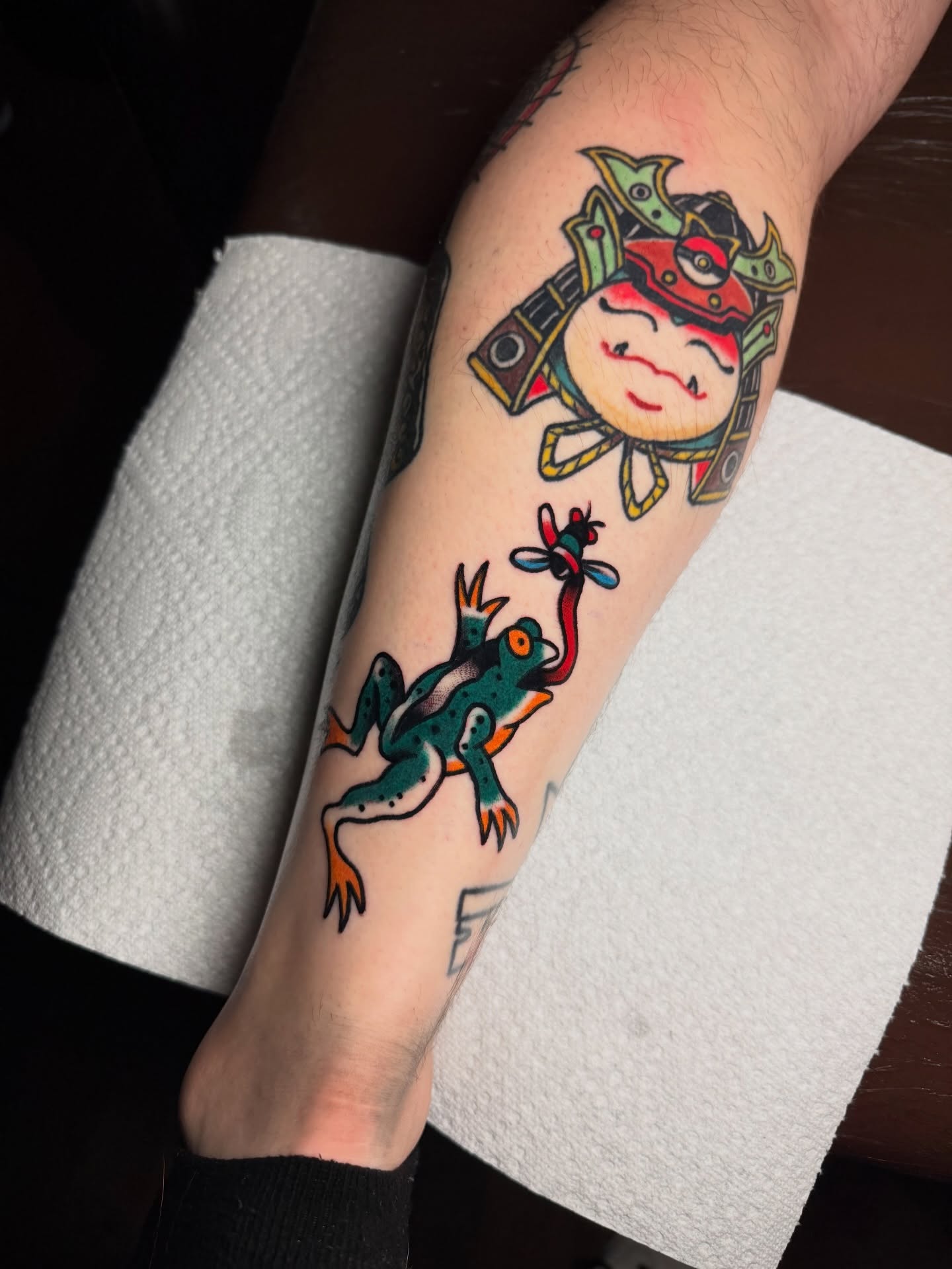 Frog and sun American traditional tattoo on the forearm by Kyle Dean Traditional Tattoo Artist