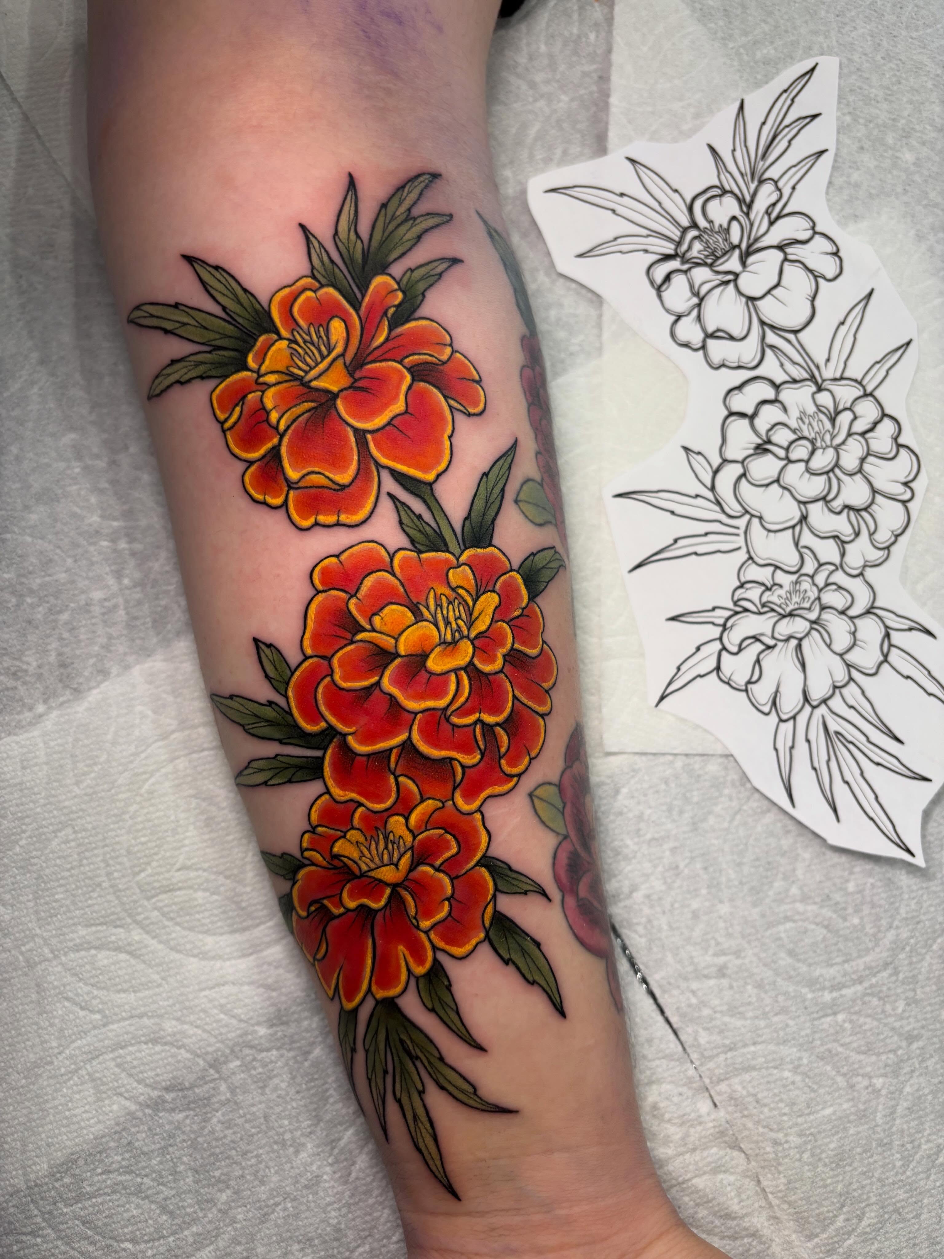Marigolds American traditional tattoo on the forearm by ✨REiD✨