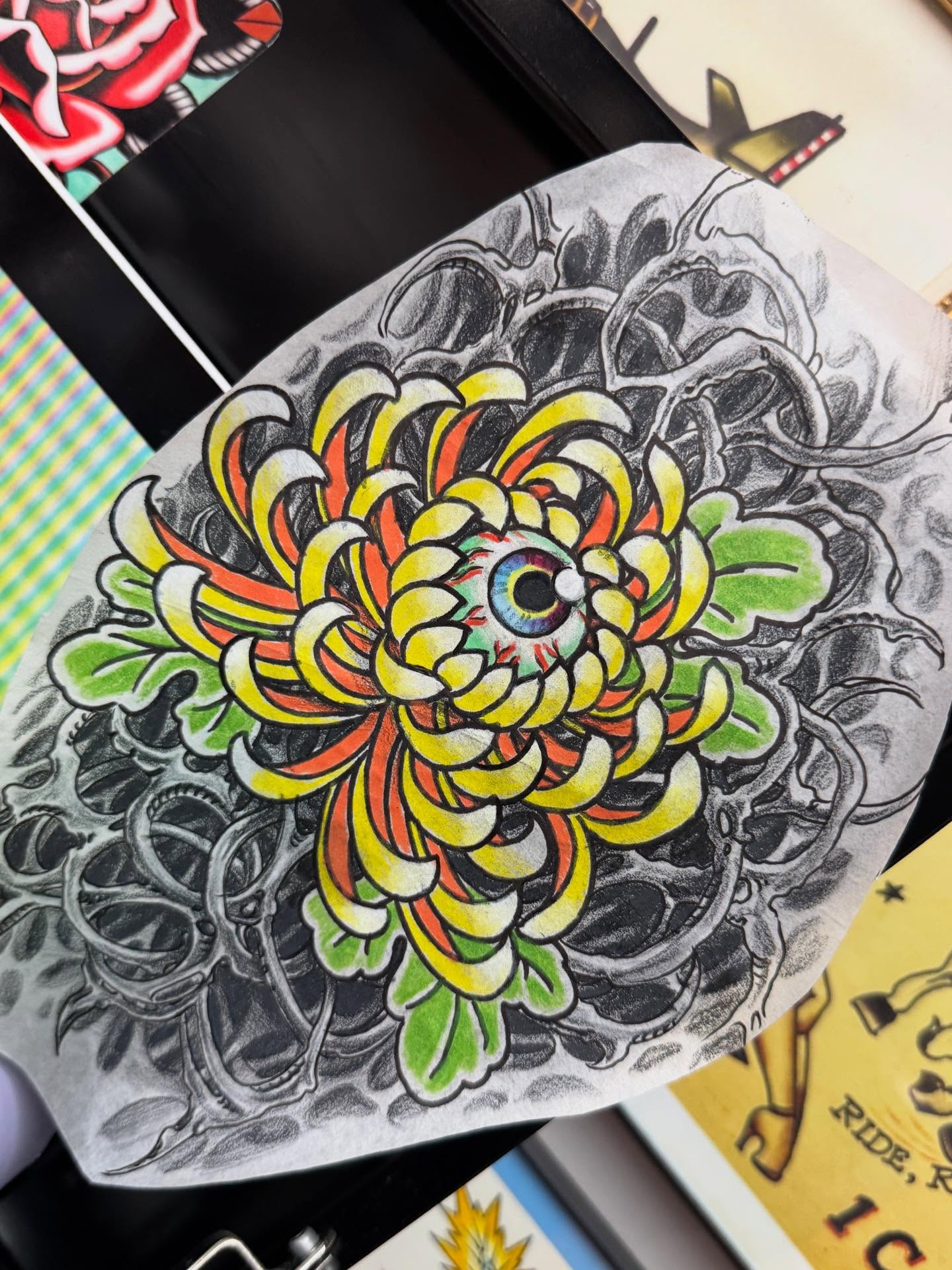 Chrysanthemum with eye American traditional tattoo by Andrew Snowden
