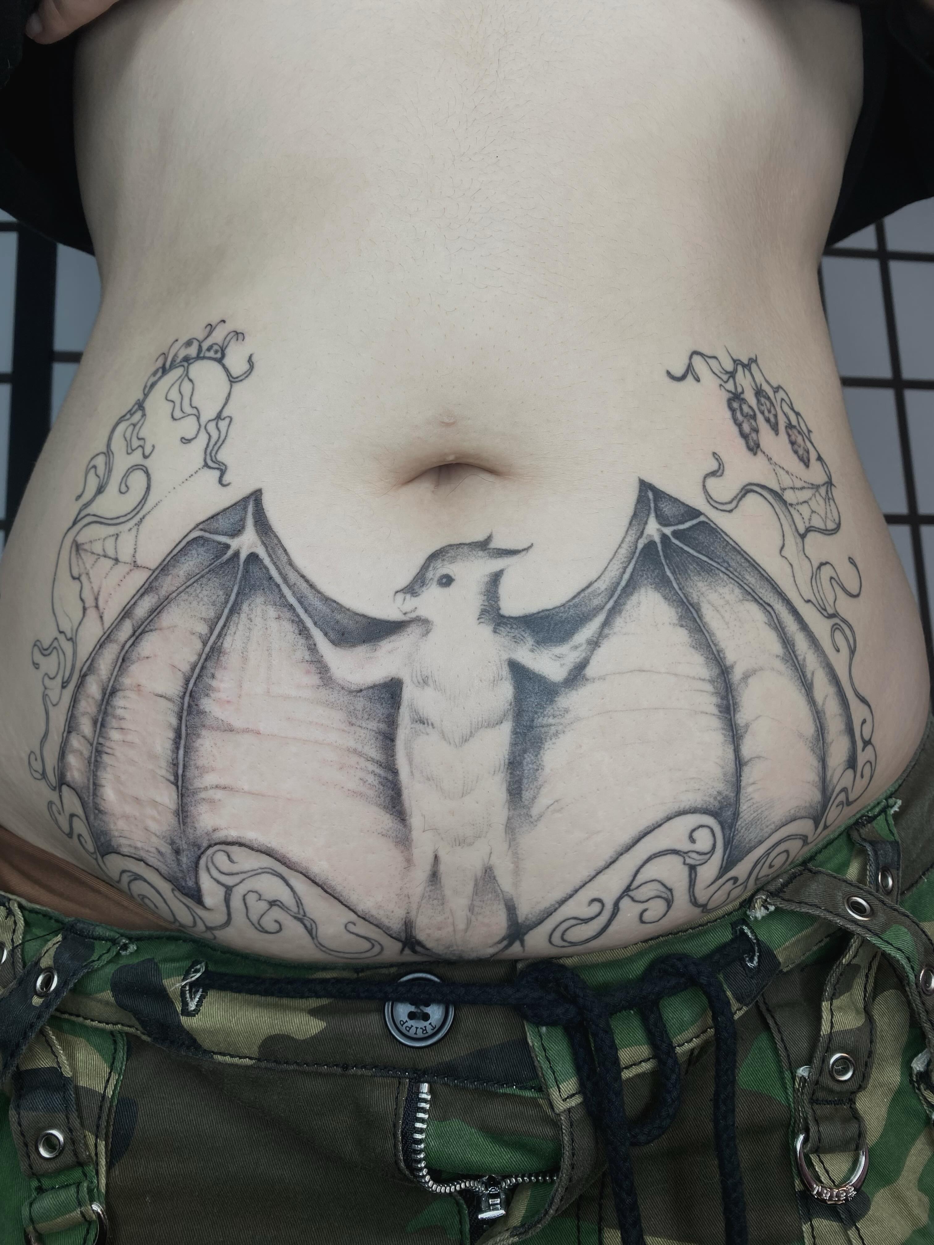 Bat black and grey tattoo on the torso by sarah 🗝️