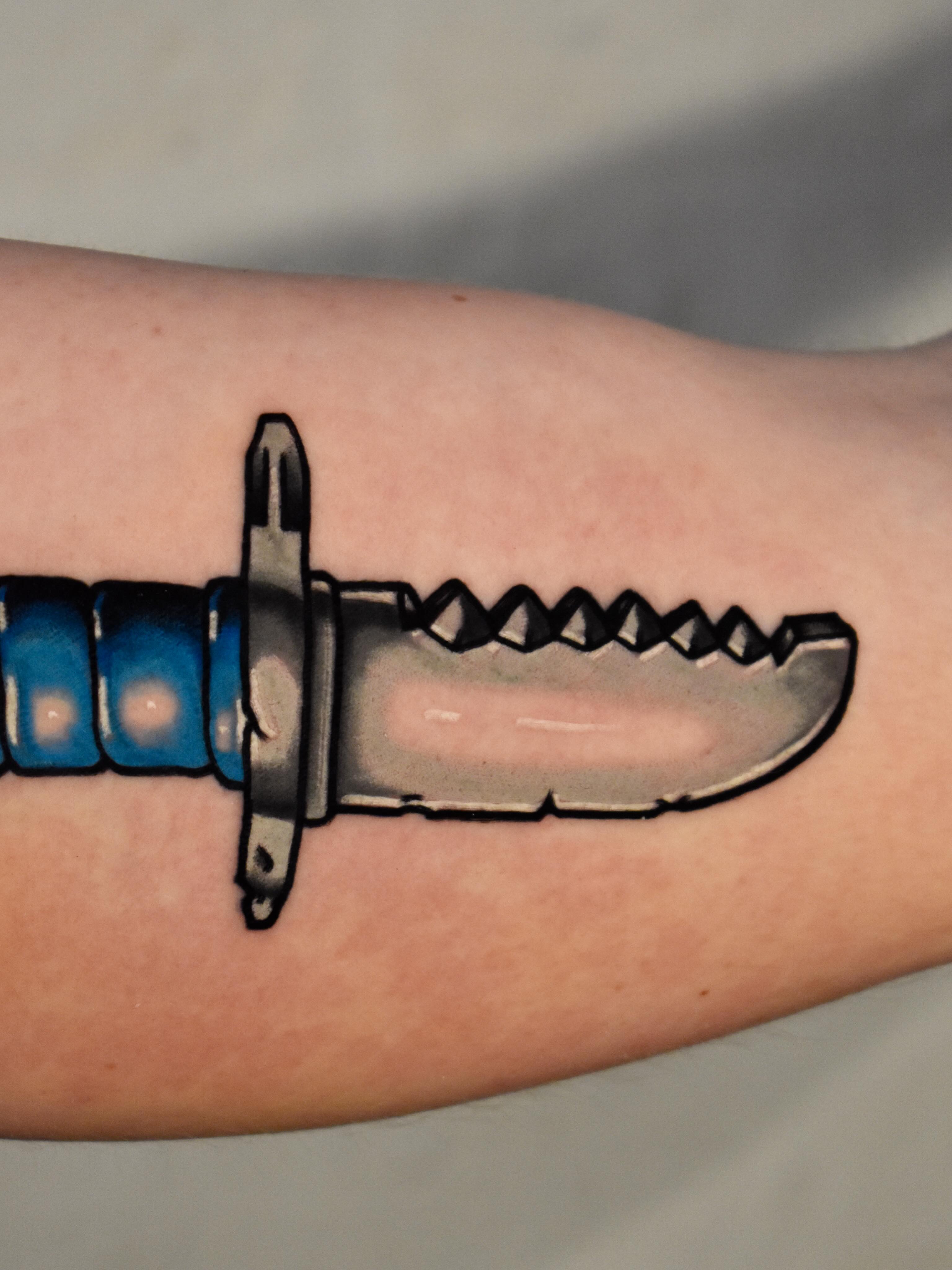 Knife realism tattoo on the forearm by Mackz