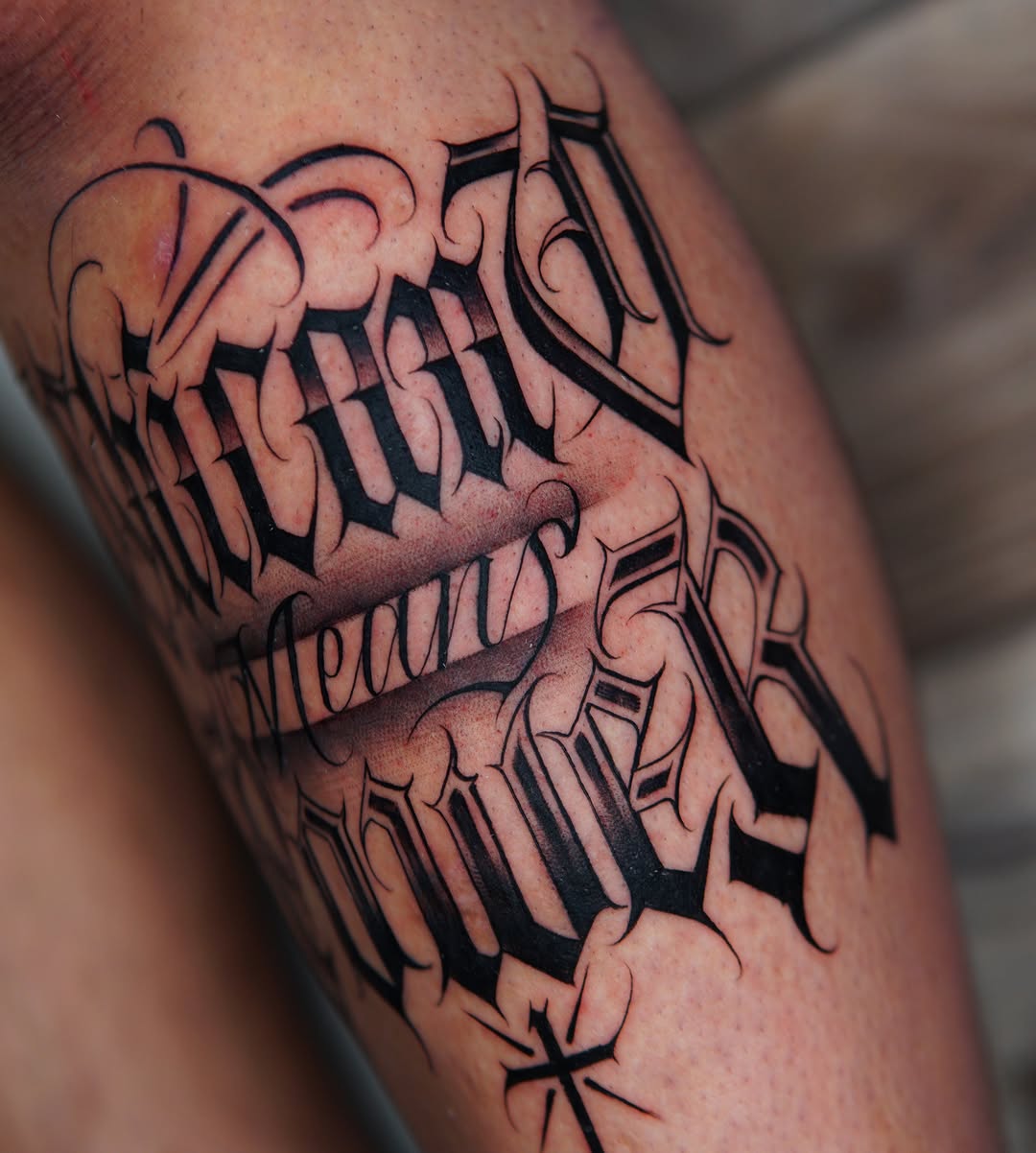 Script lettering Chicano tattoo on the thigh by Atlanta Tattoo Artist, Atlanta, Georgia