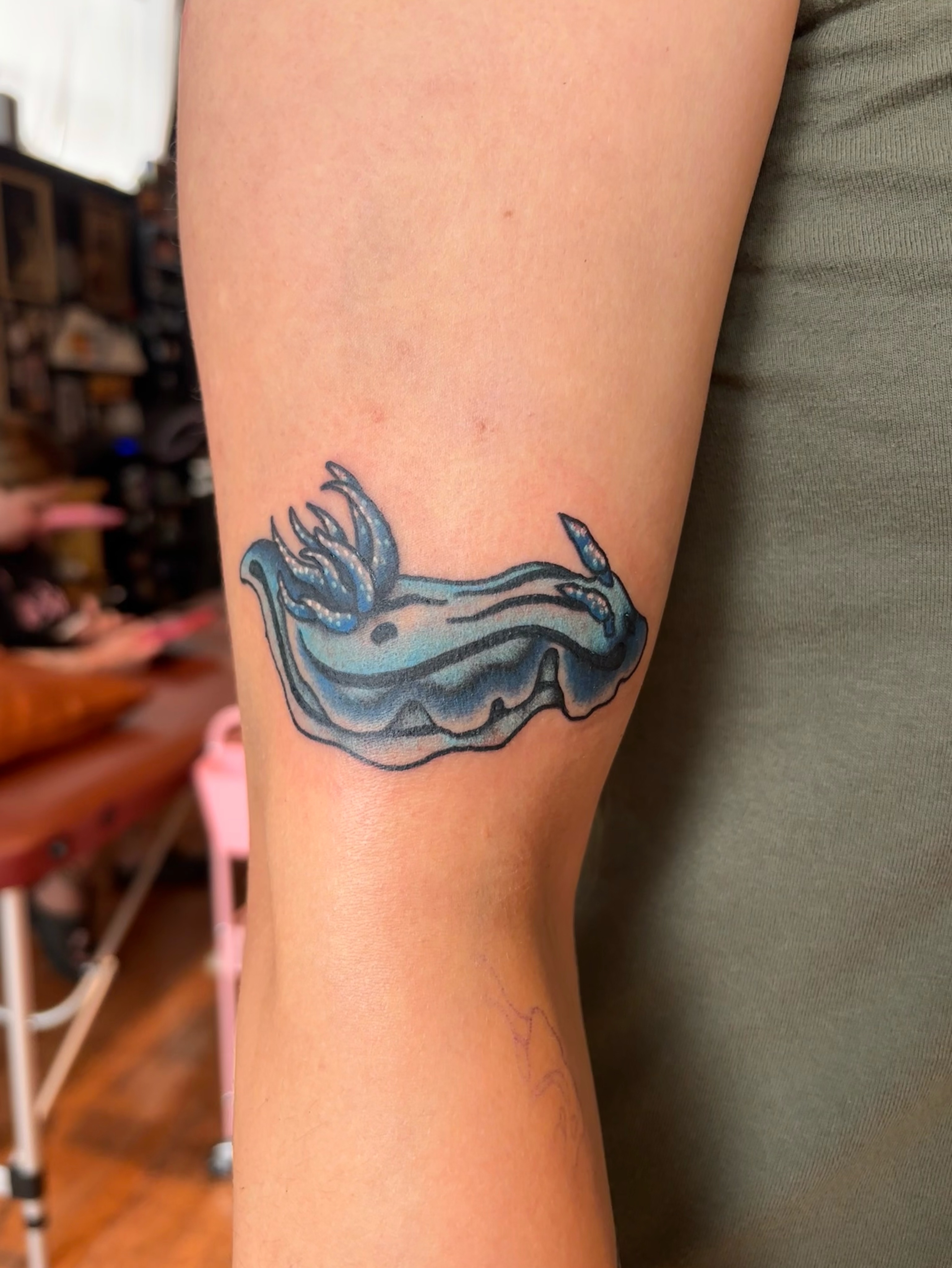 Whale new school tattoo on the forearm by Emmy Stepien