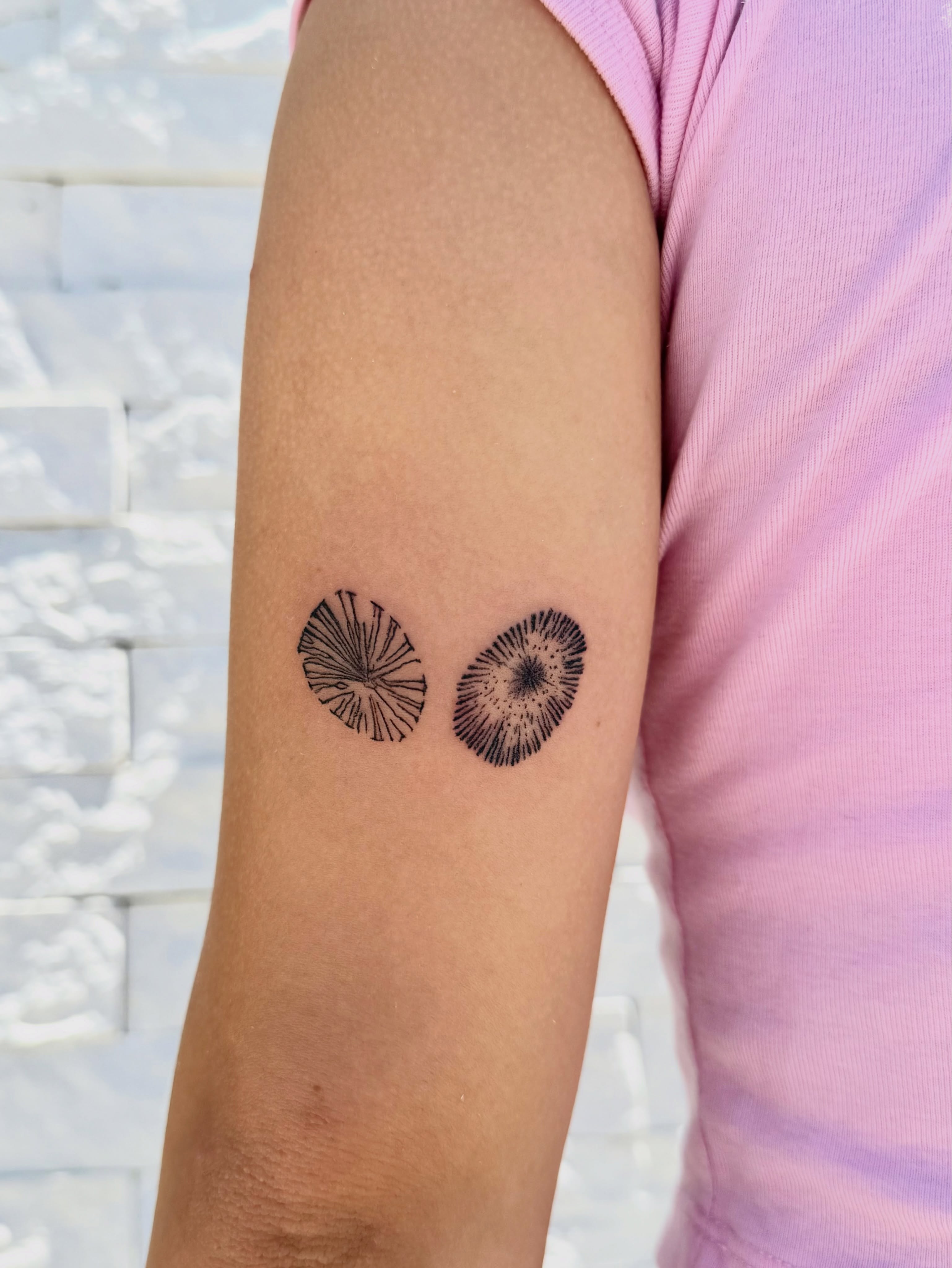 Dandelion seeds dotwork tattoo on the forearm by Healoha “Lindelle” Kamanu