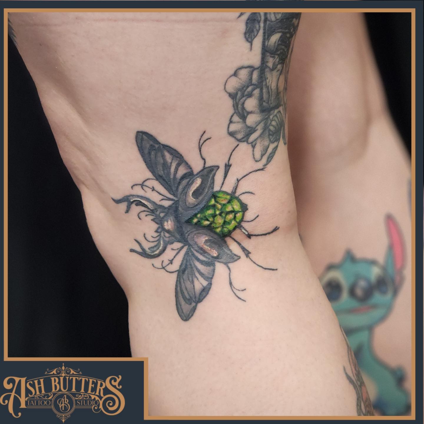 Bee and hop cone American traditional tattoo on the forearm by Ash Butters