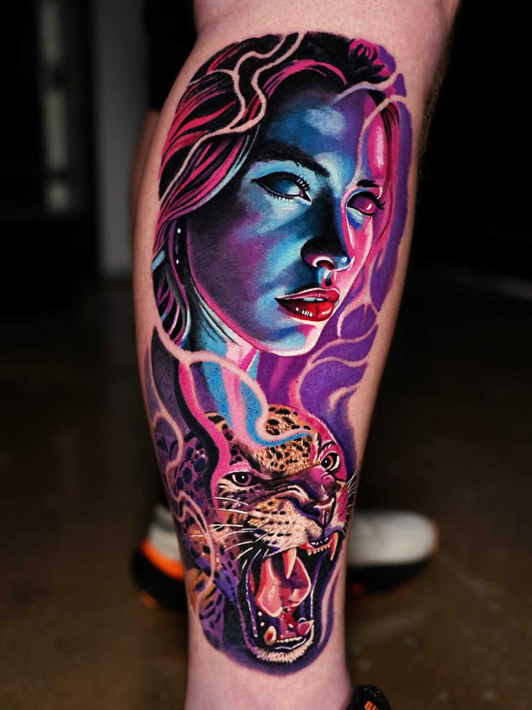Woman and jaguar surrealism tattoo on the forearm by Joshua Phillips, Mansfield, Ohio