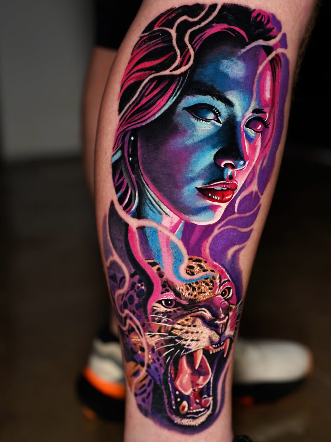 Woman and jaguar surrealism tattoo on the forearm by Joshua Phillips, Mansfield, Ohio