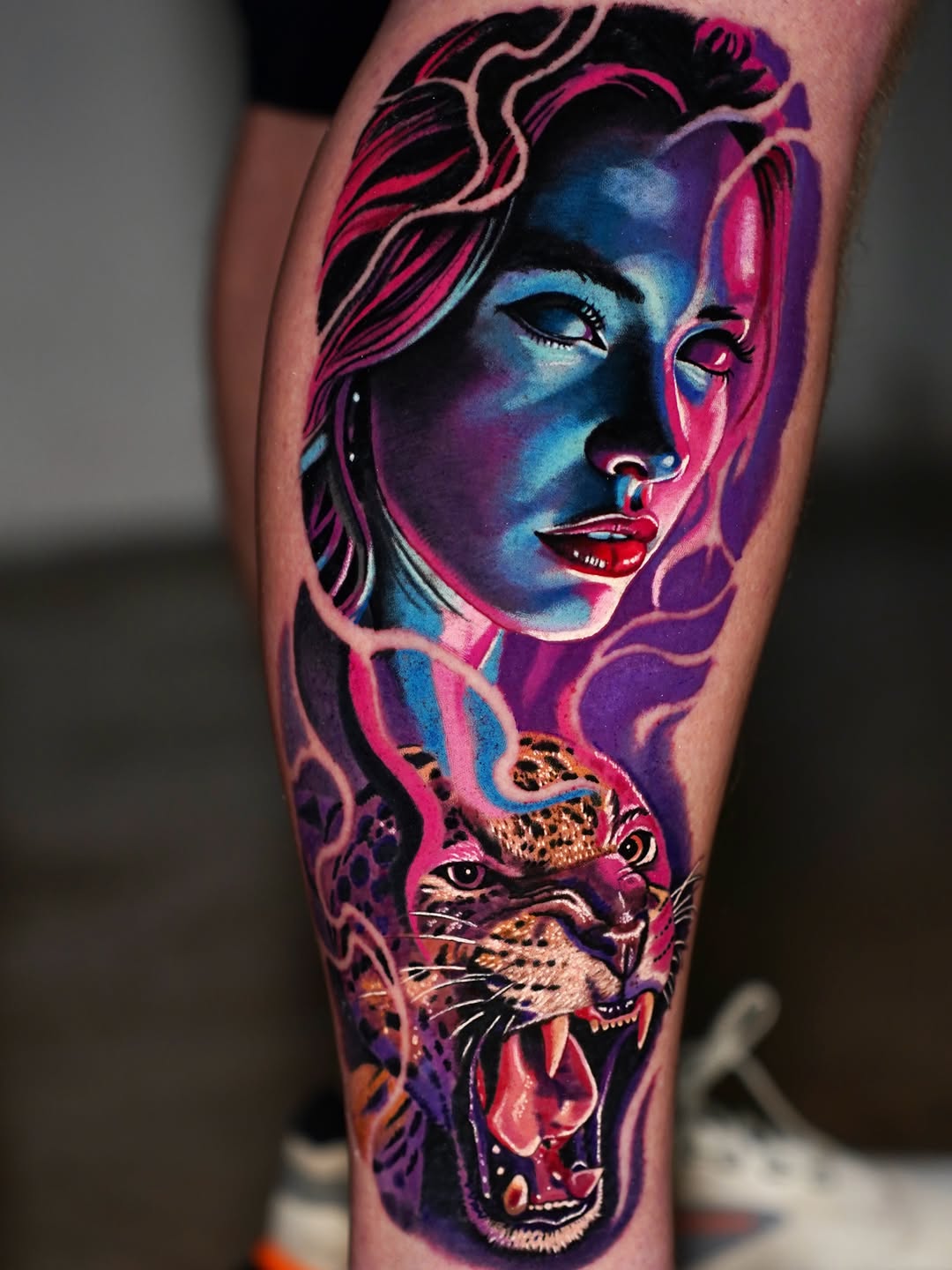Woman and jaguar surrealism tattoo on the forearm by Joshua Phillips, Mansfield, Ohio