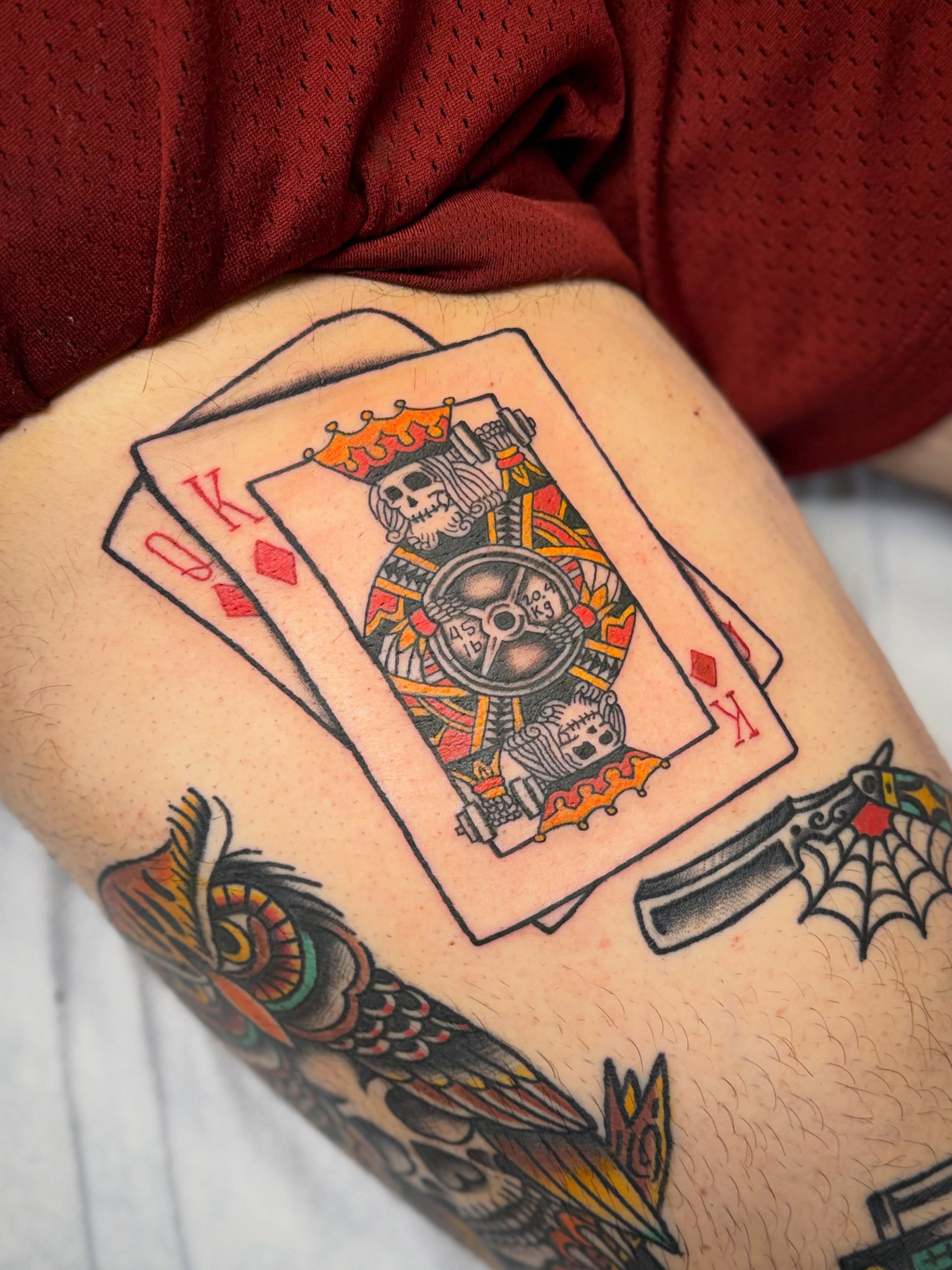 Playing cards American traditional tattoo on the upper arm by Shannon Pagliarini