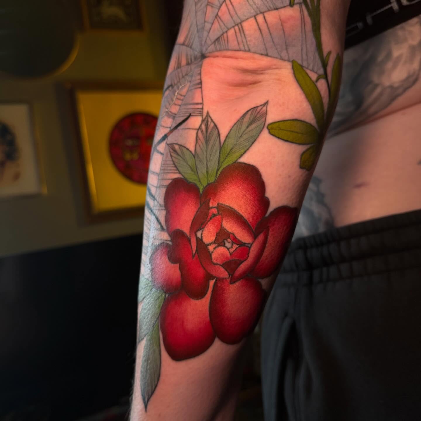 Red rose realism tattoo on the forearm by Reagan Mauldin
