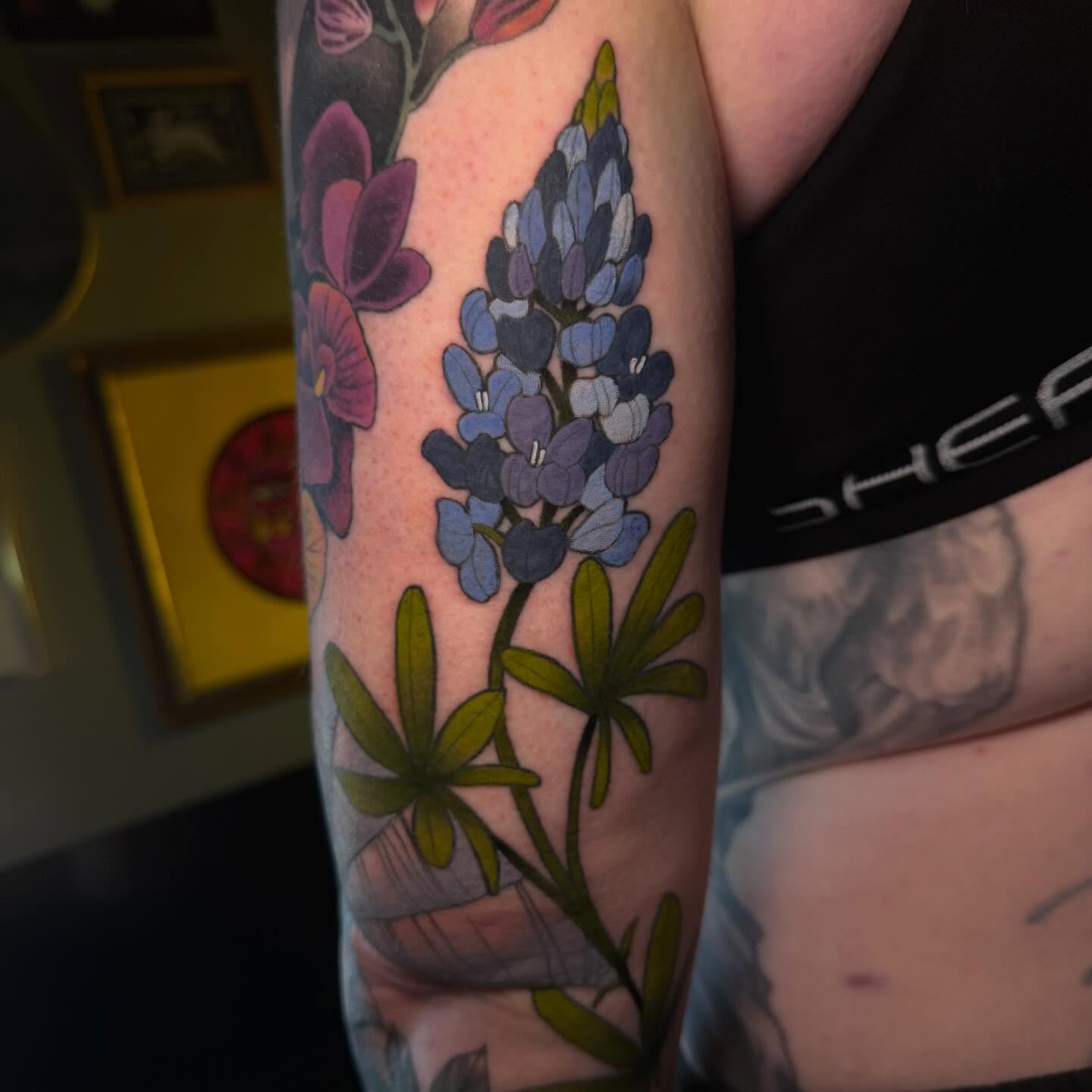 Bluebonnet flowers realism tattoo on the forearm by Reagan Mauldin
