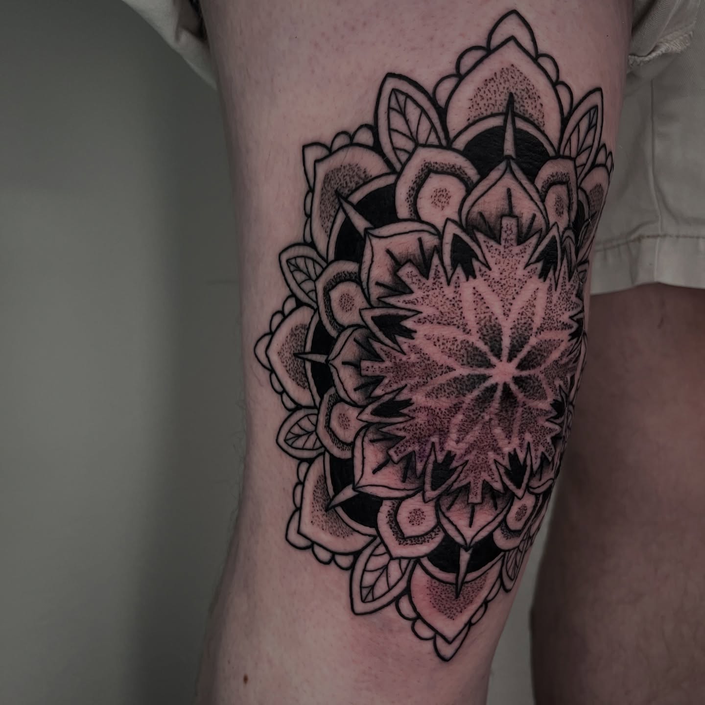 Floral mandala dotwork tattoo on the forearm by Jordan Hunt