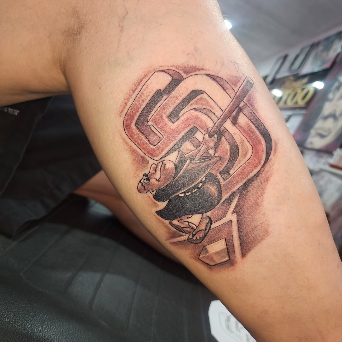 Baseball player black and grey tattoo on the forearm by Joe Garcia