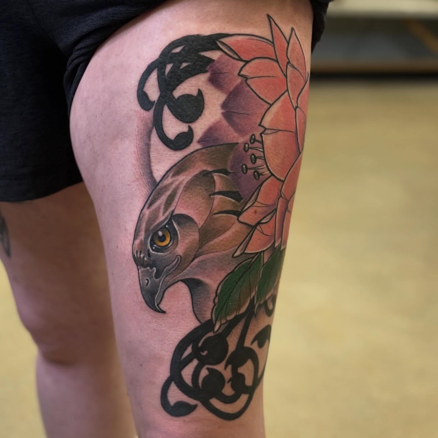 Hawk and lotus realism tattoo on the thigh by Chris Smiseck