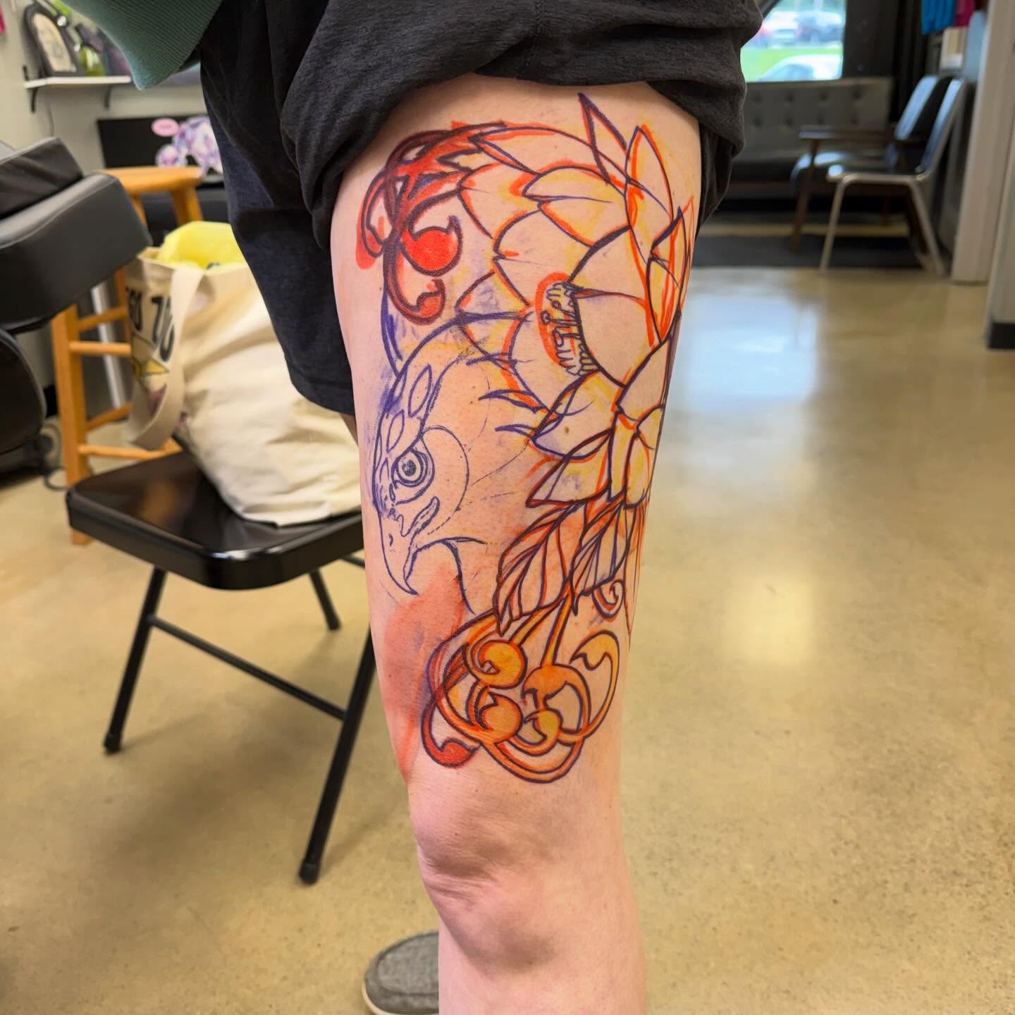 Bird and cherries watercolor tattoo on the thigh by Chris Smiseck