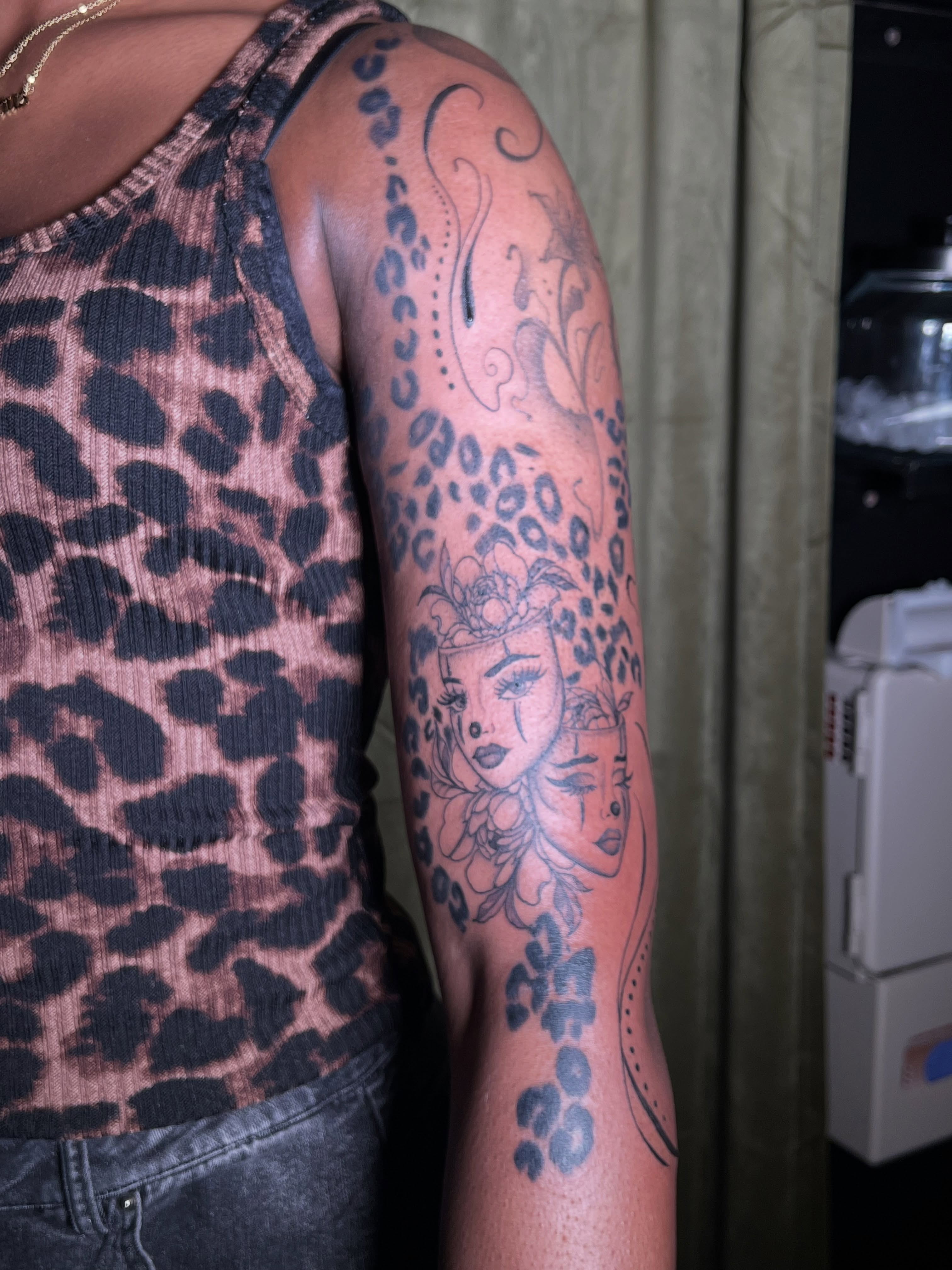 Woman with floral crown dotwork tattoo on the forearm by V