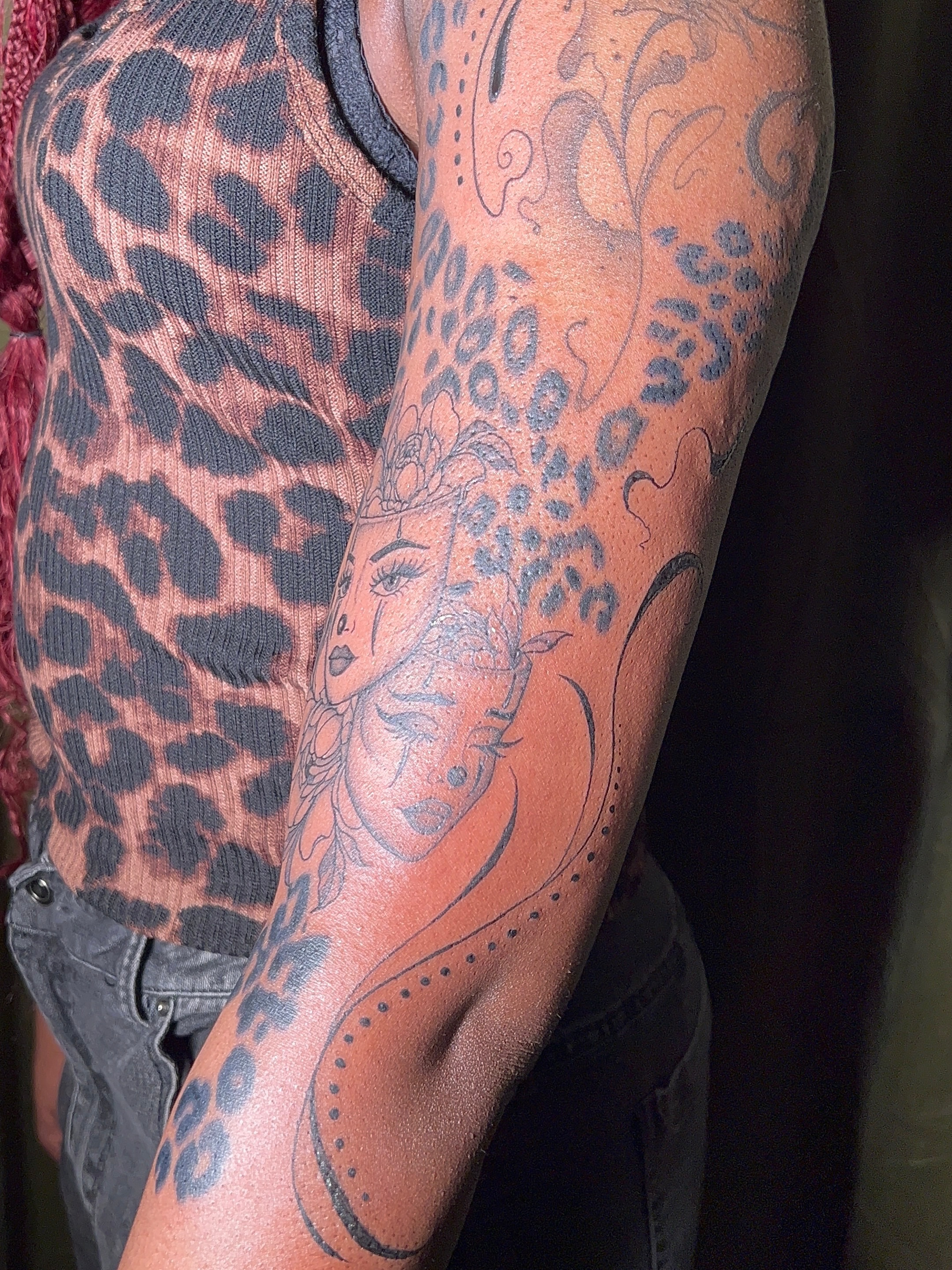 Woman's face dotwork tattoo on the forearm by V