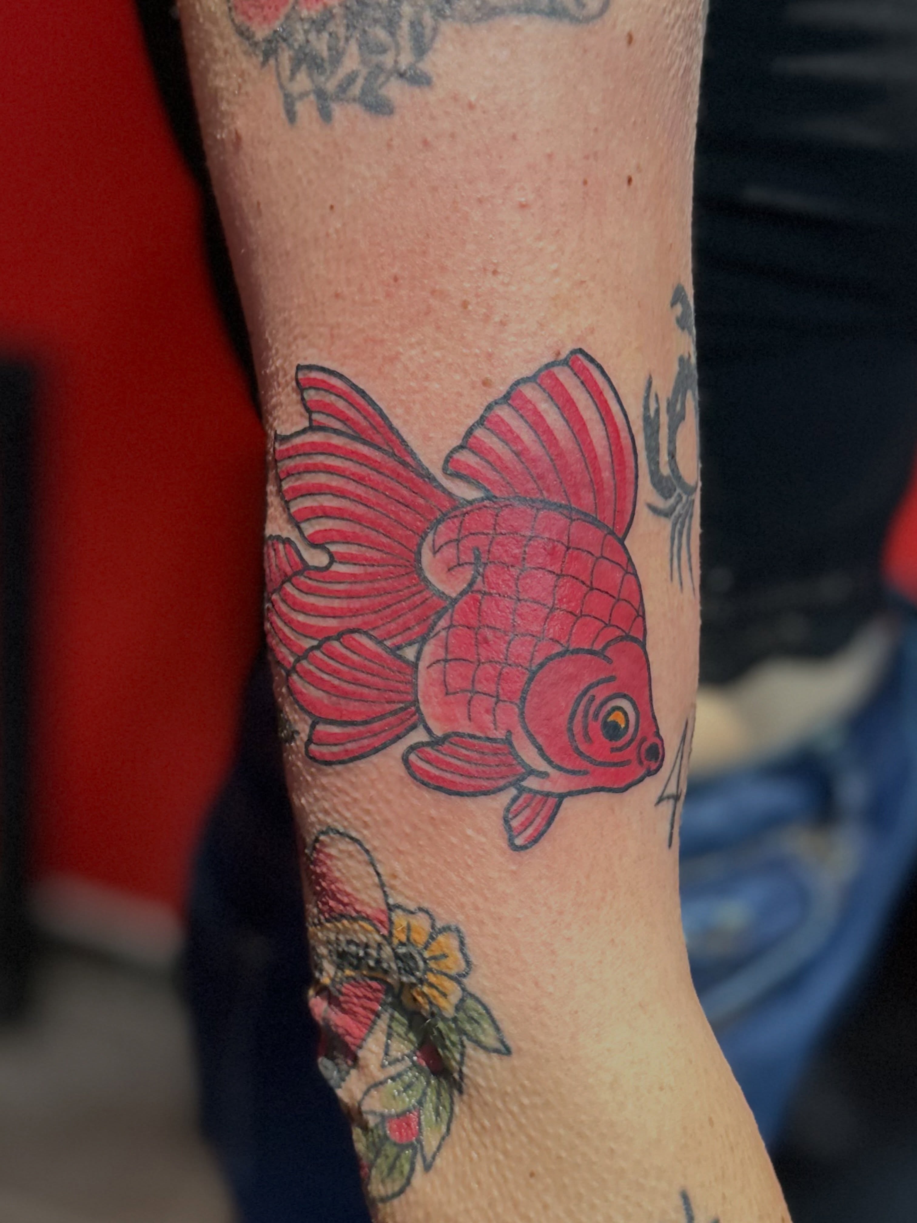 Goldfish American traditional tattoo on the forearm by Walk-in American Traditional Tattoos Las