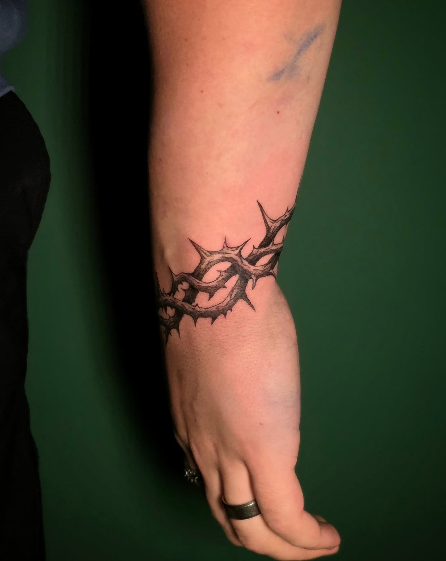 Thorn crown black and grey tattoo on the forearm by Nick de Hoyos