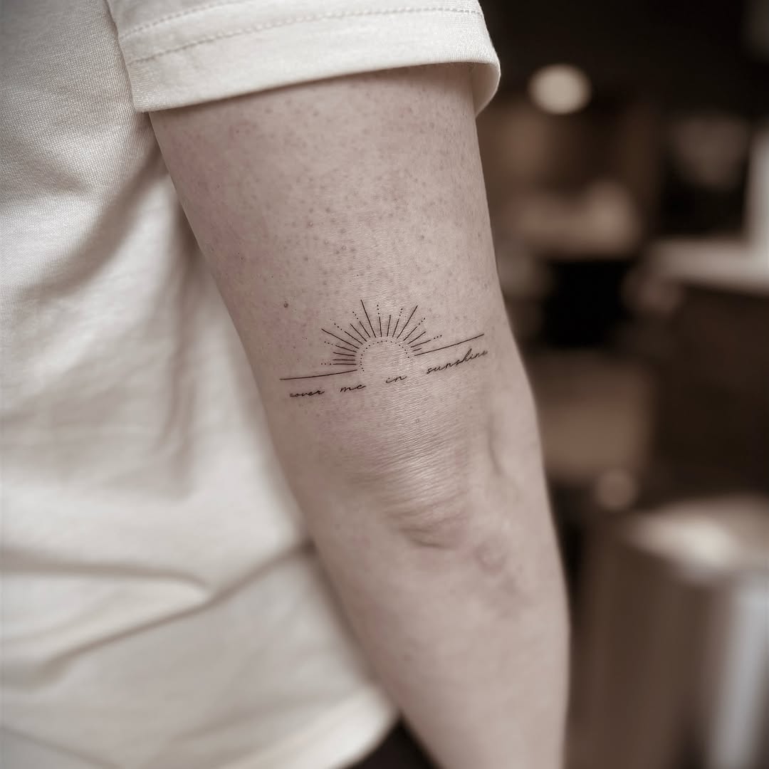 Sunburst with phrase dotwork tattoo on the forearm by Chanel Picquelle, Nashville, Tennessee