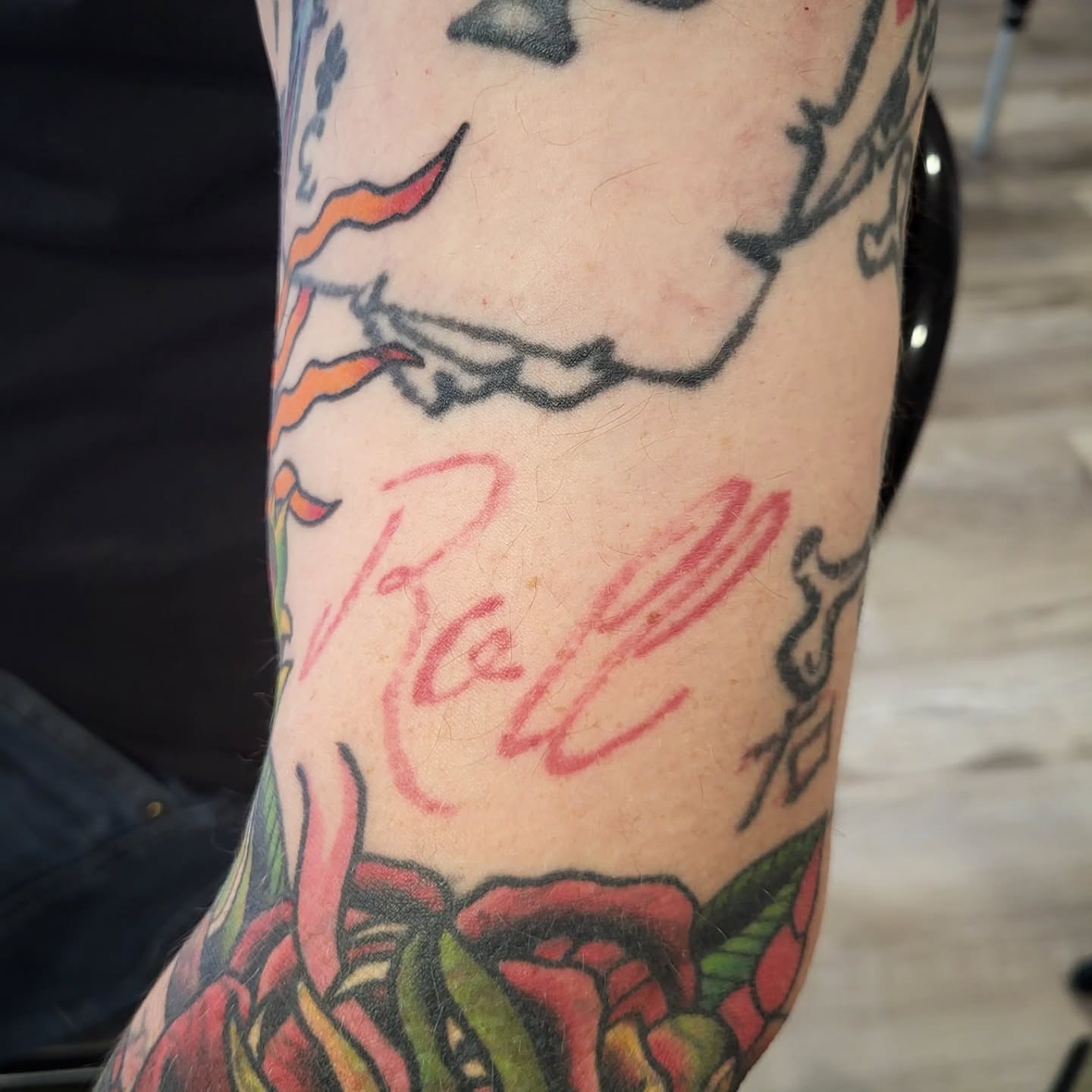 Script lettering American traditional tattoo on the forearm by Sloan Smith
