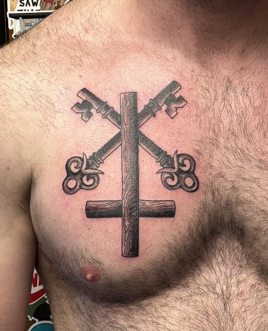Cross keys black and grey tattoo on the chest by Jeff Zuptich