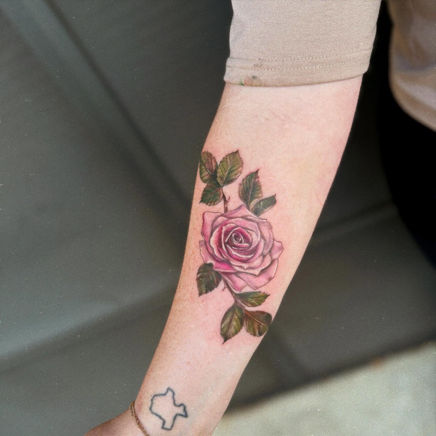 Rose realism tattoo on the forearm by KT