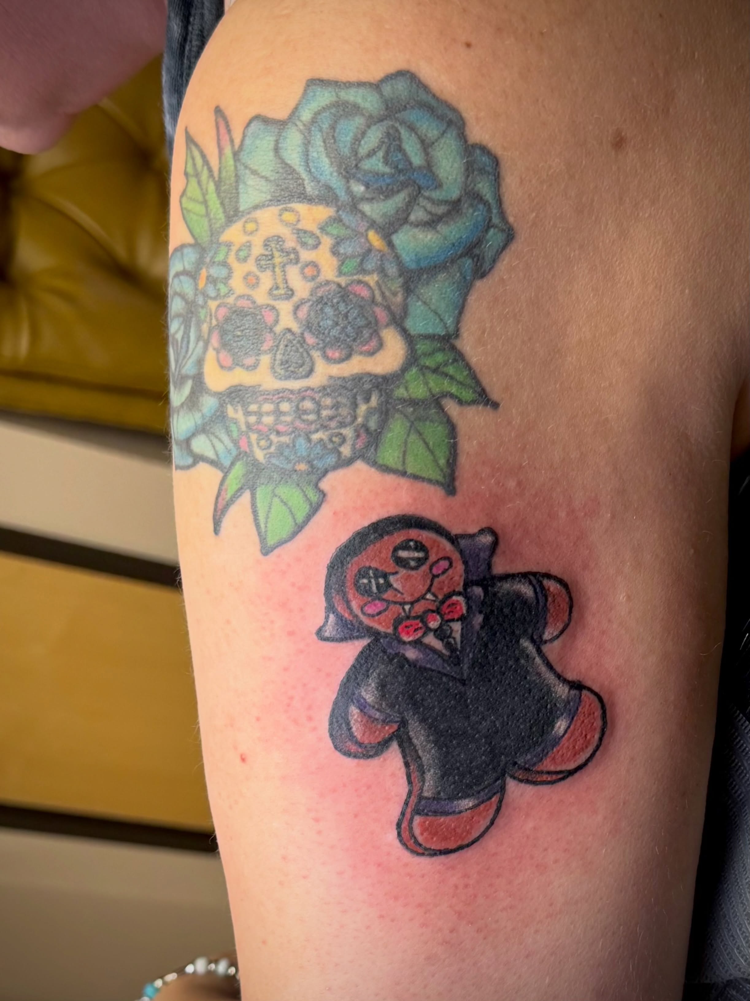 Sugar skull and rose American traditional tattoo on the thigh by Bob Howdy