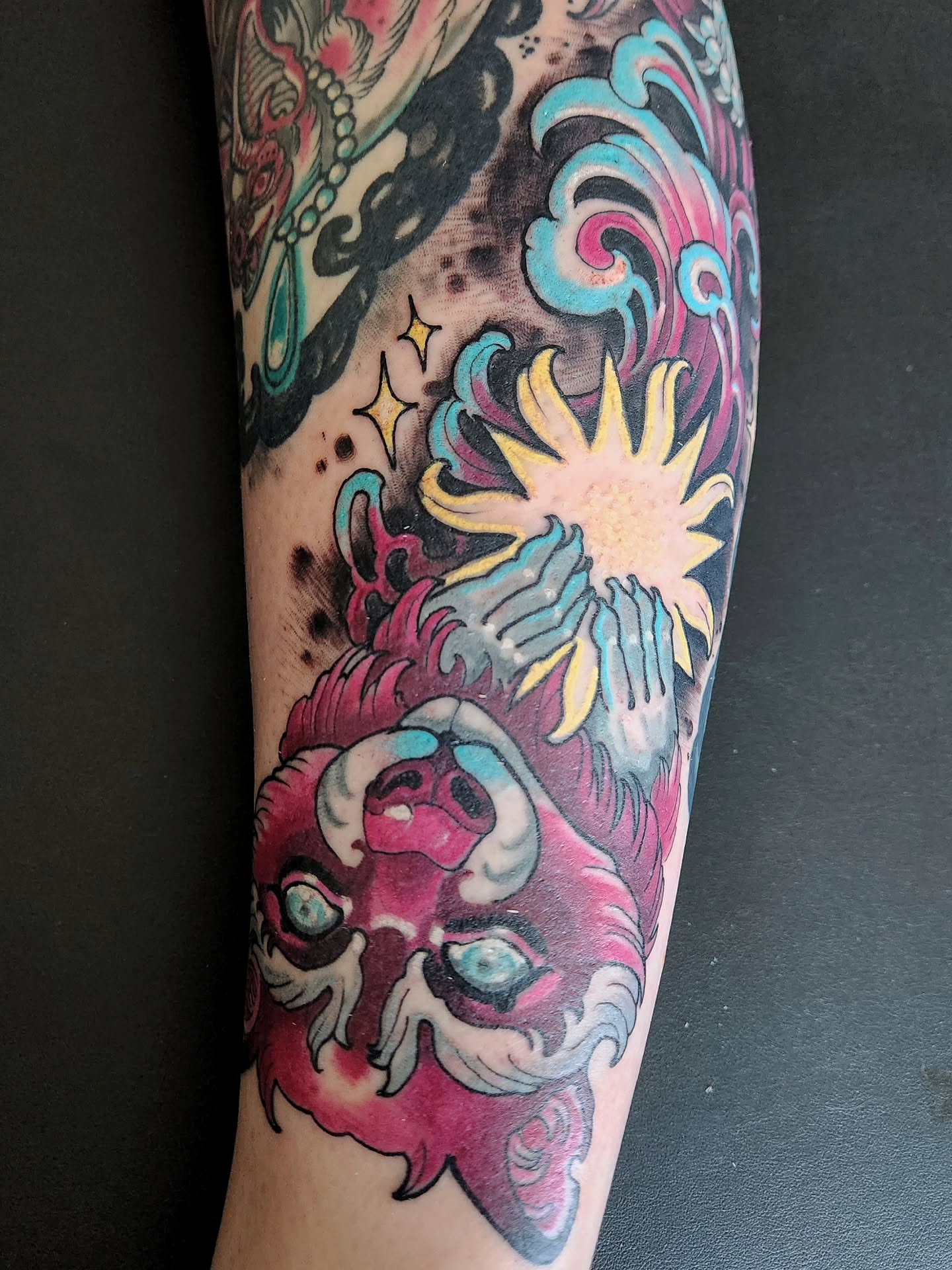 Lion and sun American traditional tattoo on the forearm by Randy