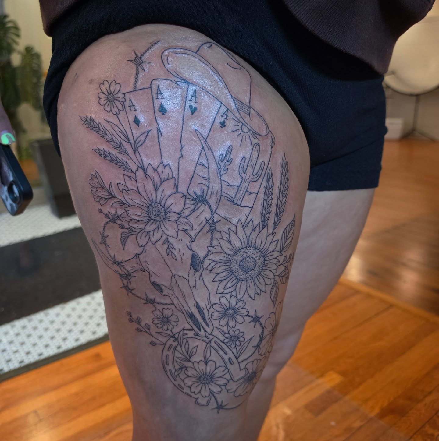 Playing cards and floral black and grey tattoo on the thigh by Solstice Tattoos by Savannah Sadler (future, Salisbury, North Carolina