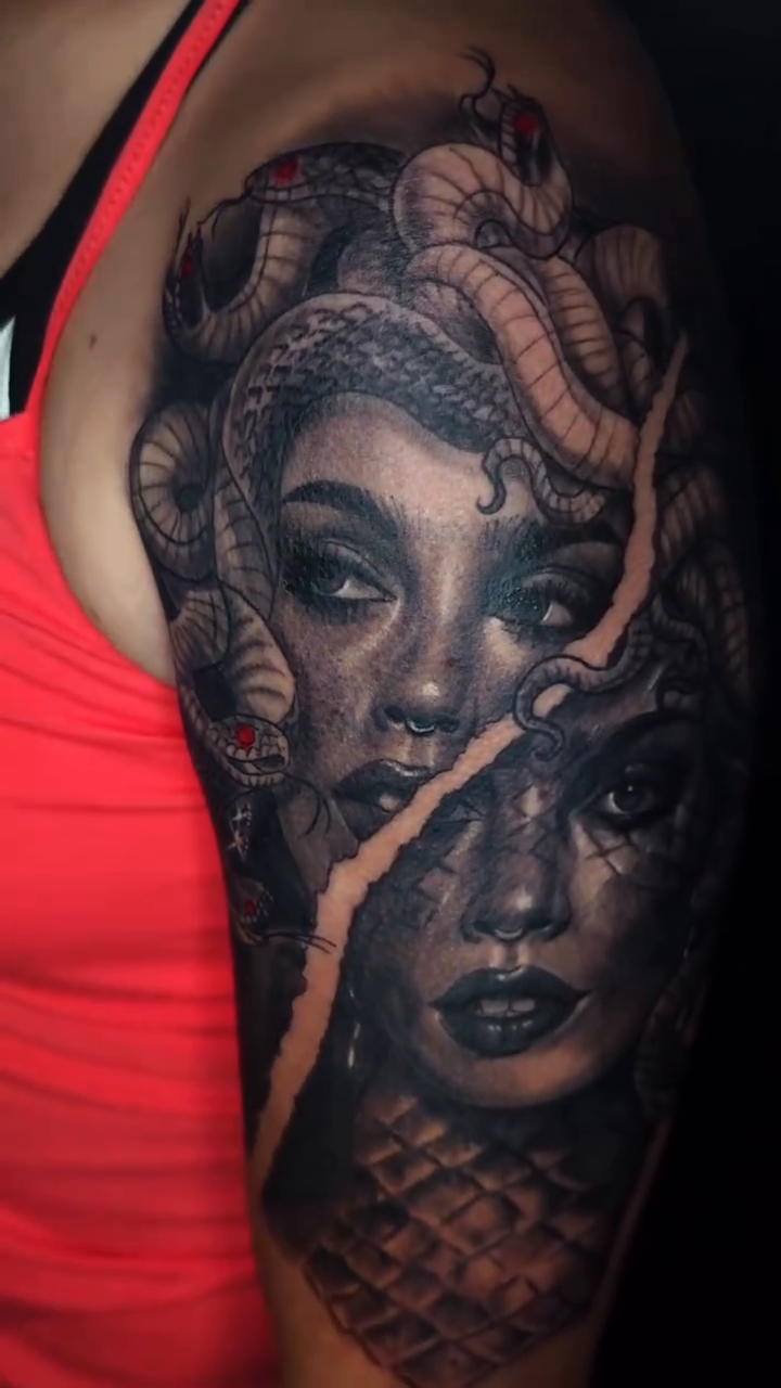 Medusa and another woman realism tattoo on the upper arm by Ian Duncanson