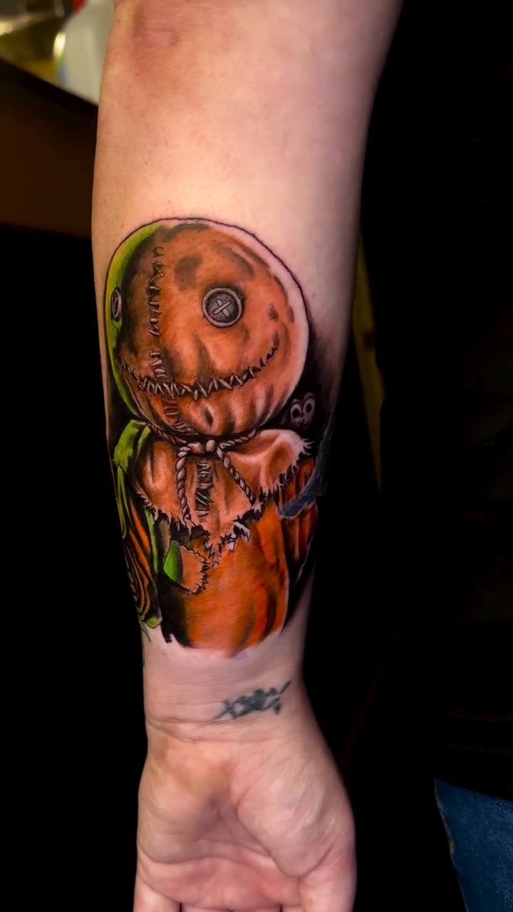 Sam from Trick 'r Treat realism tattoo on the forearm by Deacon Moser