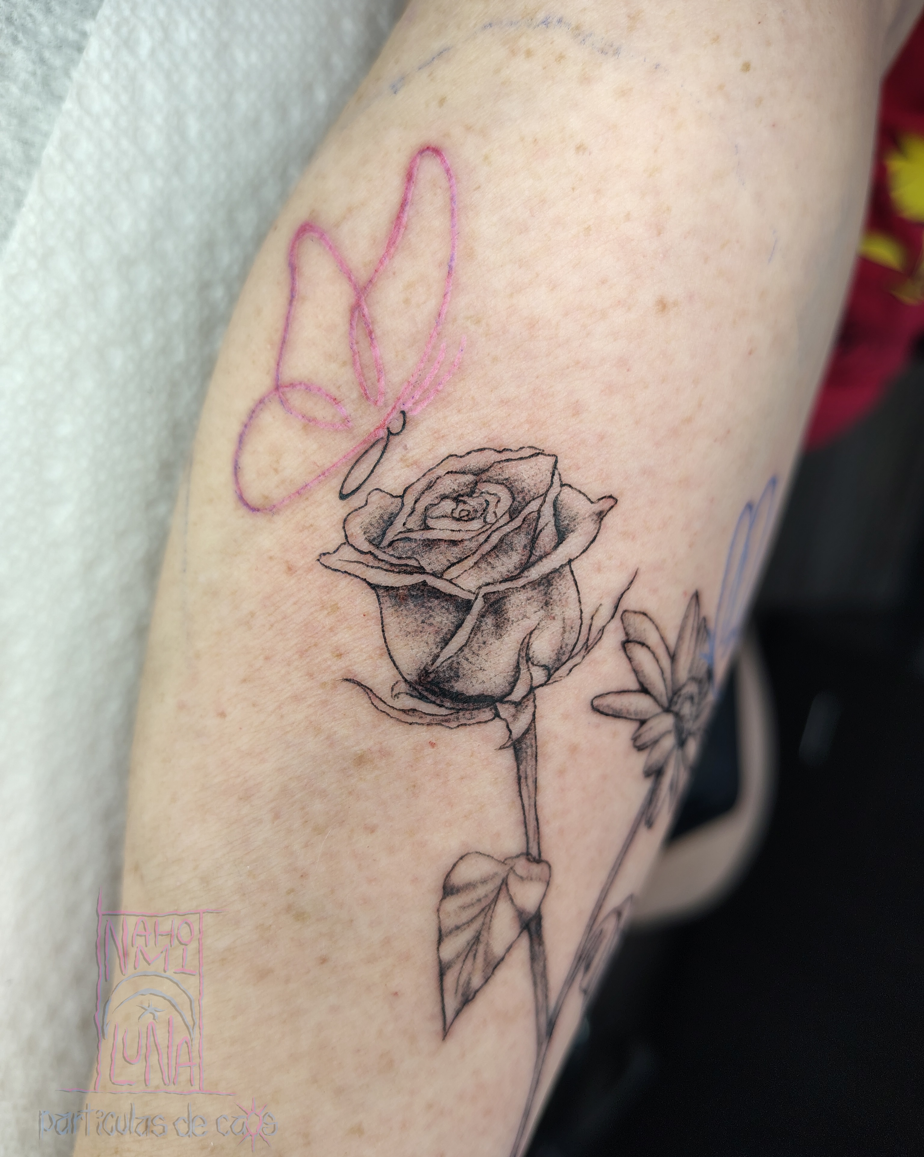 Rose and butterfly realism tattoo on the forearm by Nahomi Luna - Memphis & Cordova Tattoo, Memphis, Tennessee
