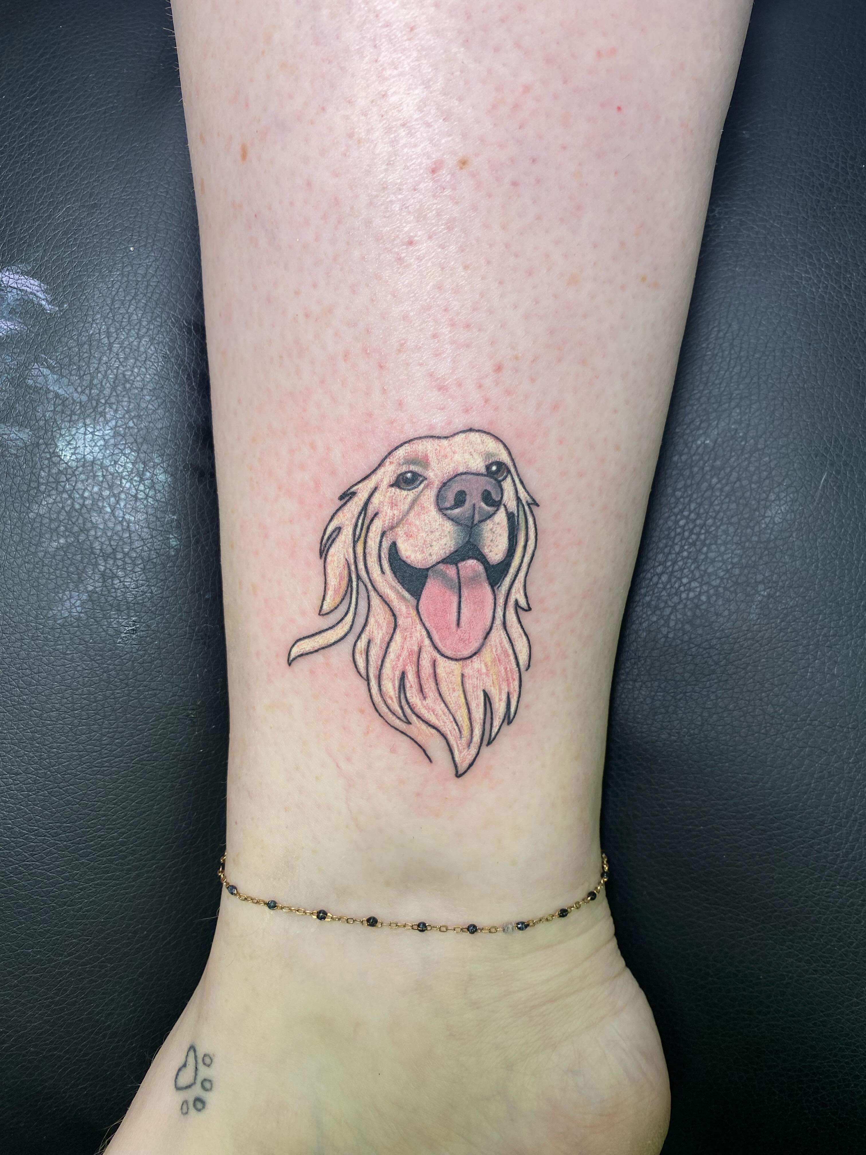Golden retriever realism tattoo on the forearm by Katie Leeper