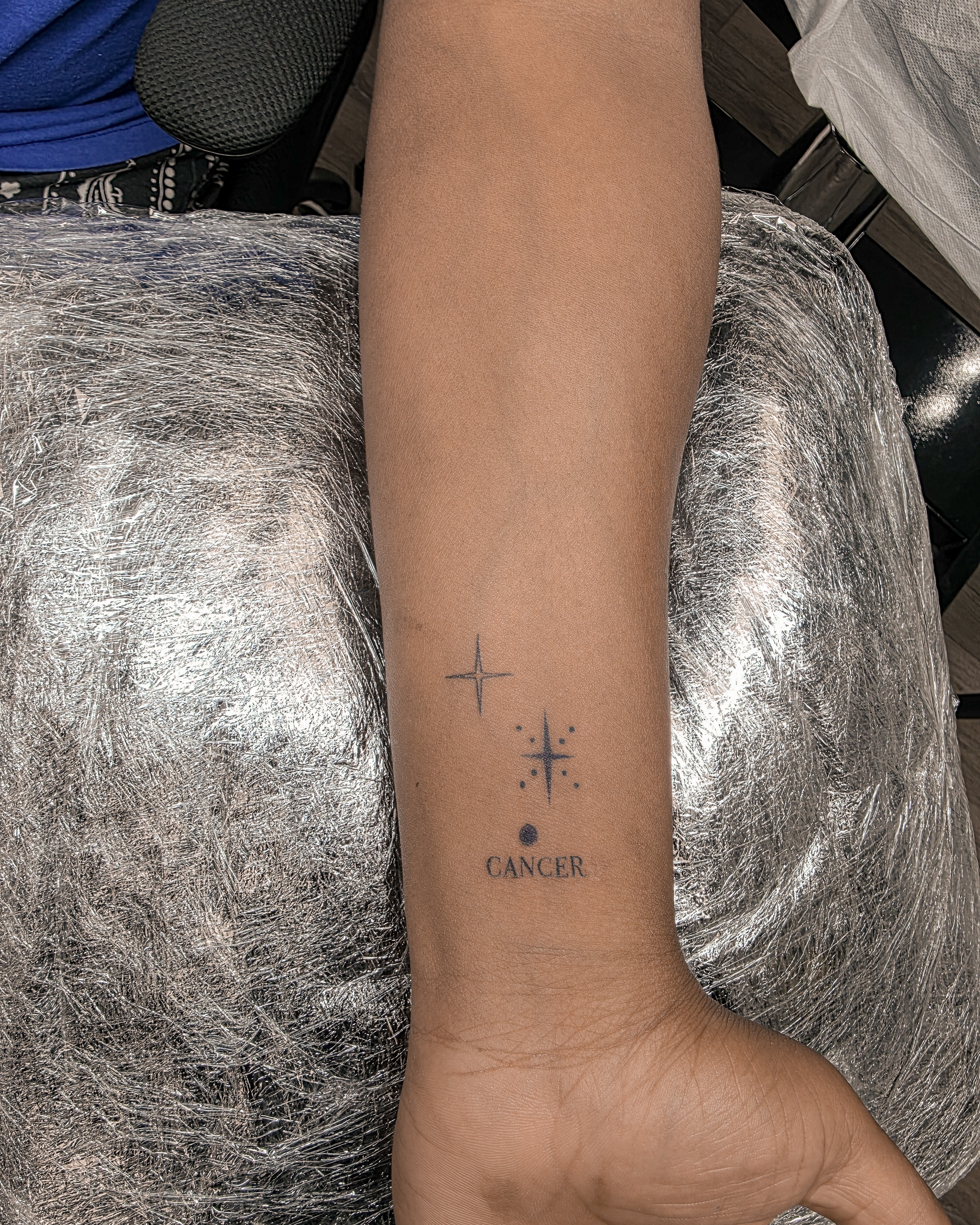 Cancer symbol dotwork tattoo on the forearm by Richmond tattoo shop, Richmond, Texas