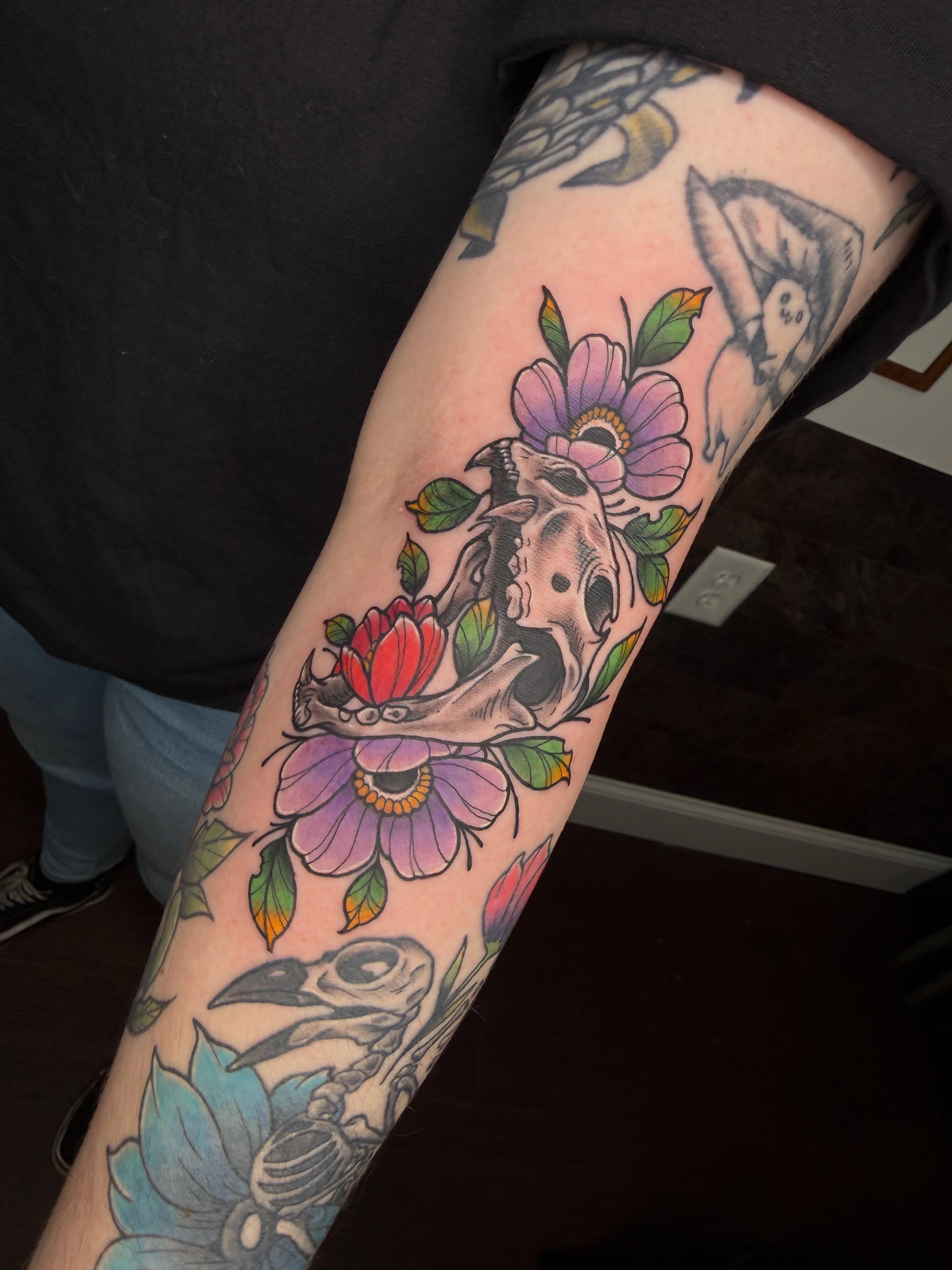 Flower skull American traditional tattoo on the forearm by Jezza Munson