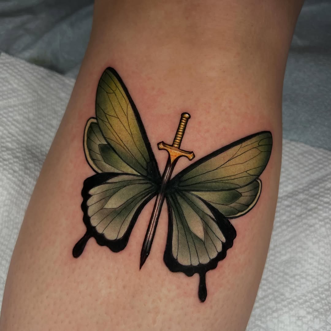 Butterfly with sword fine line tattoo on the forearm by High Vibrations