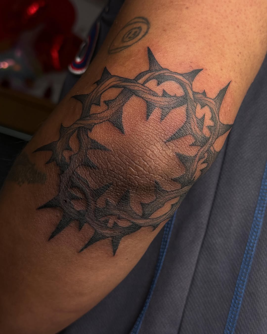 Crown of thorns black and grey tattoo on the forearm by Christian