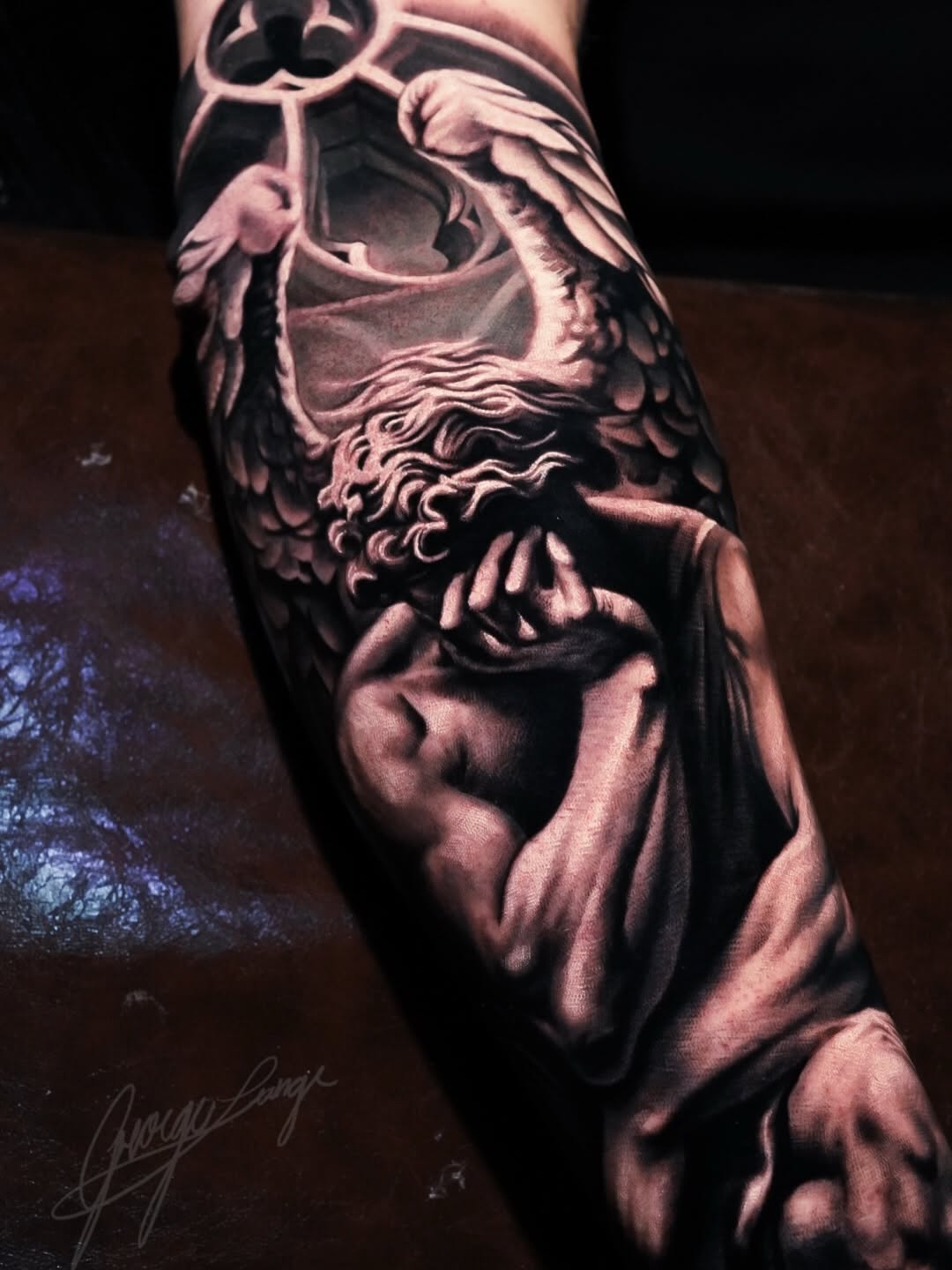 Realism tattoo on the forearm by George Lange
