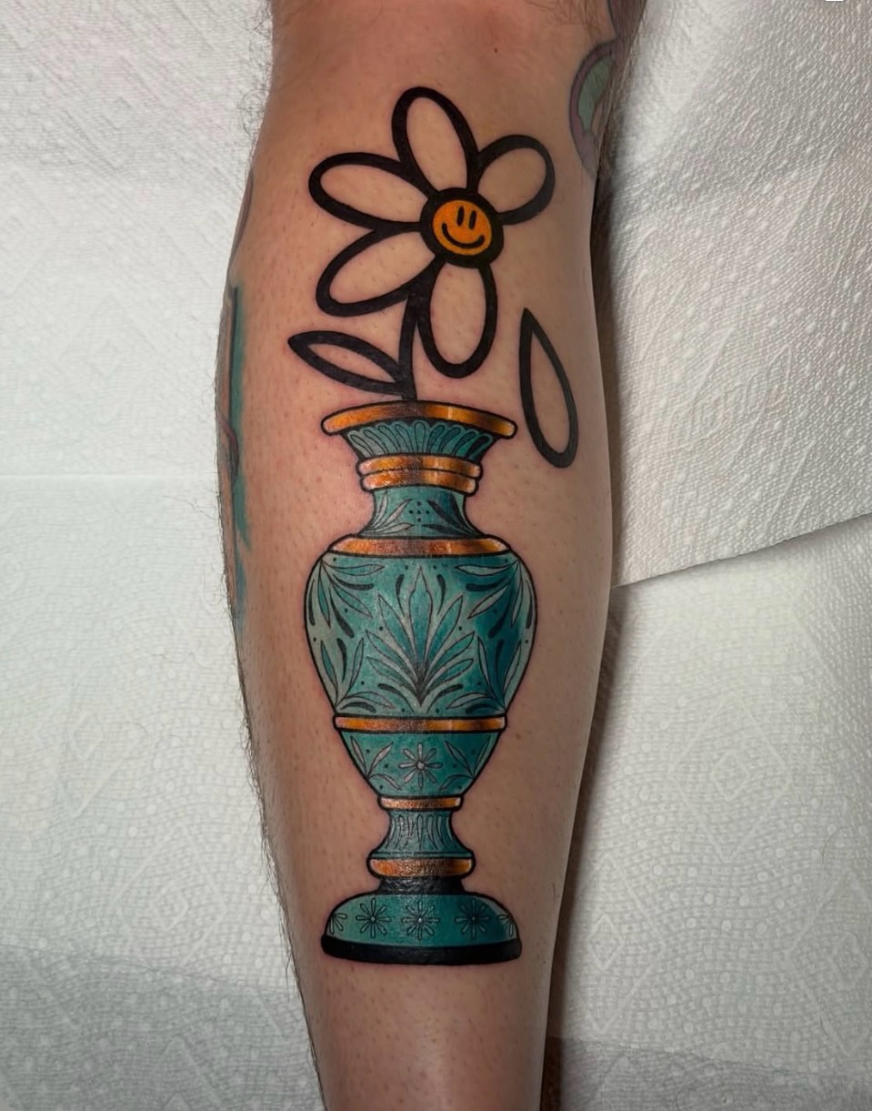 Vase with flower American traditional tattoo on the forearm by Denver Blackout Tattoo Specialist - Anthony