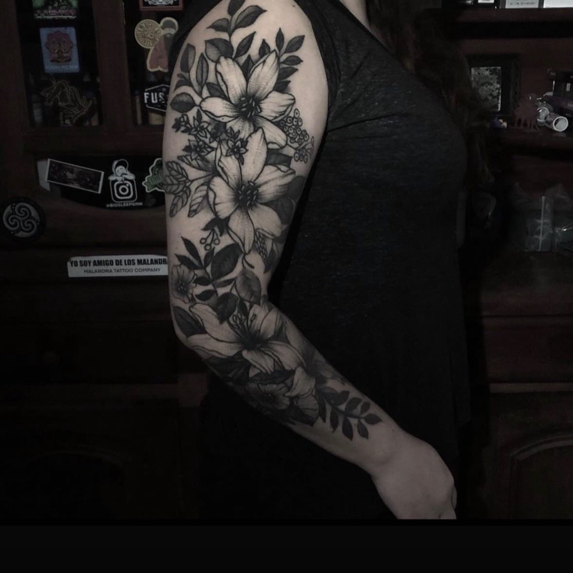Floral bouquet black and grey tattoo on the upper arm by Mtctattoos