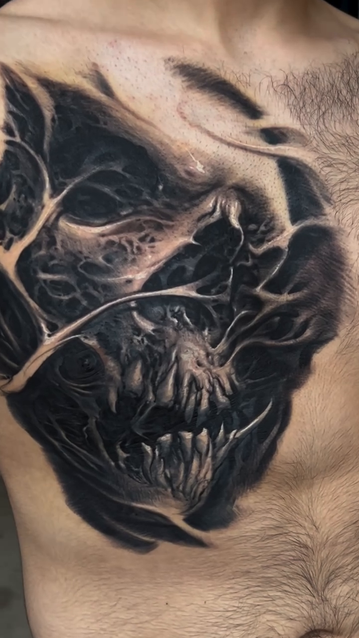 Demonic chest piece realism tattoo on the chest by David Jorquera